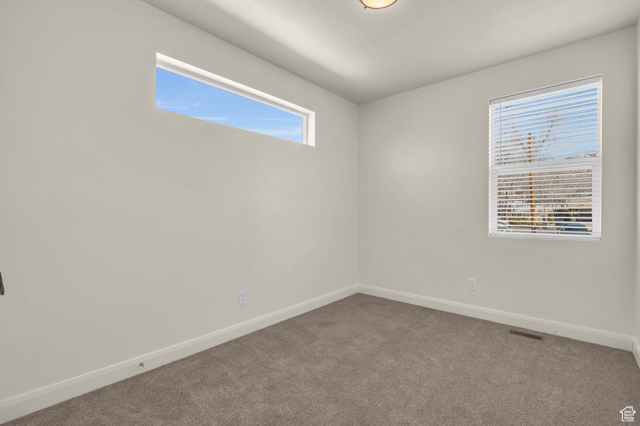 View of carpeted spare room