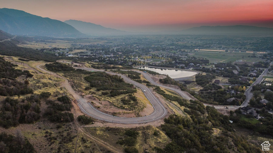 Aerial view at dusk with a water and mountain view