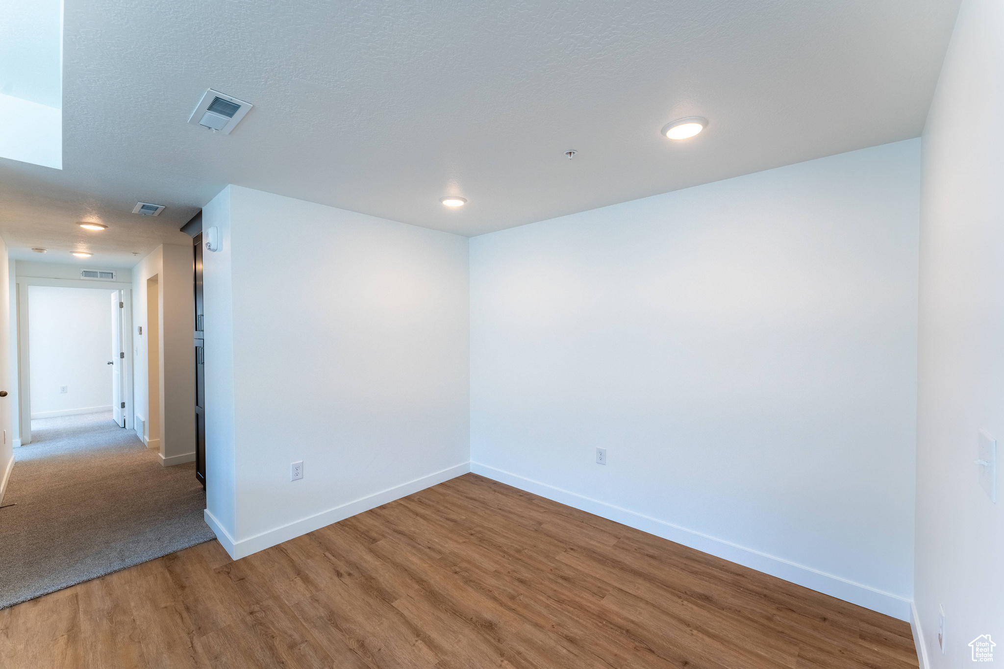Spare room with hardwood / wood-style flooring