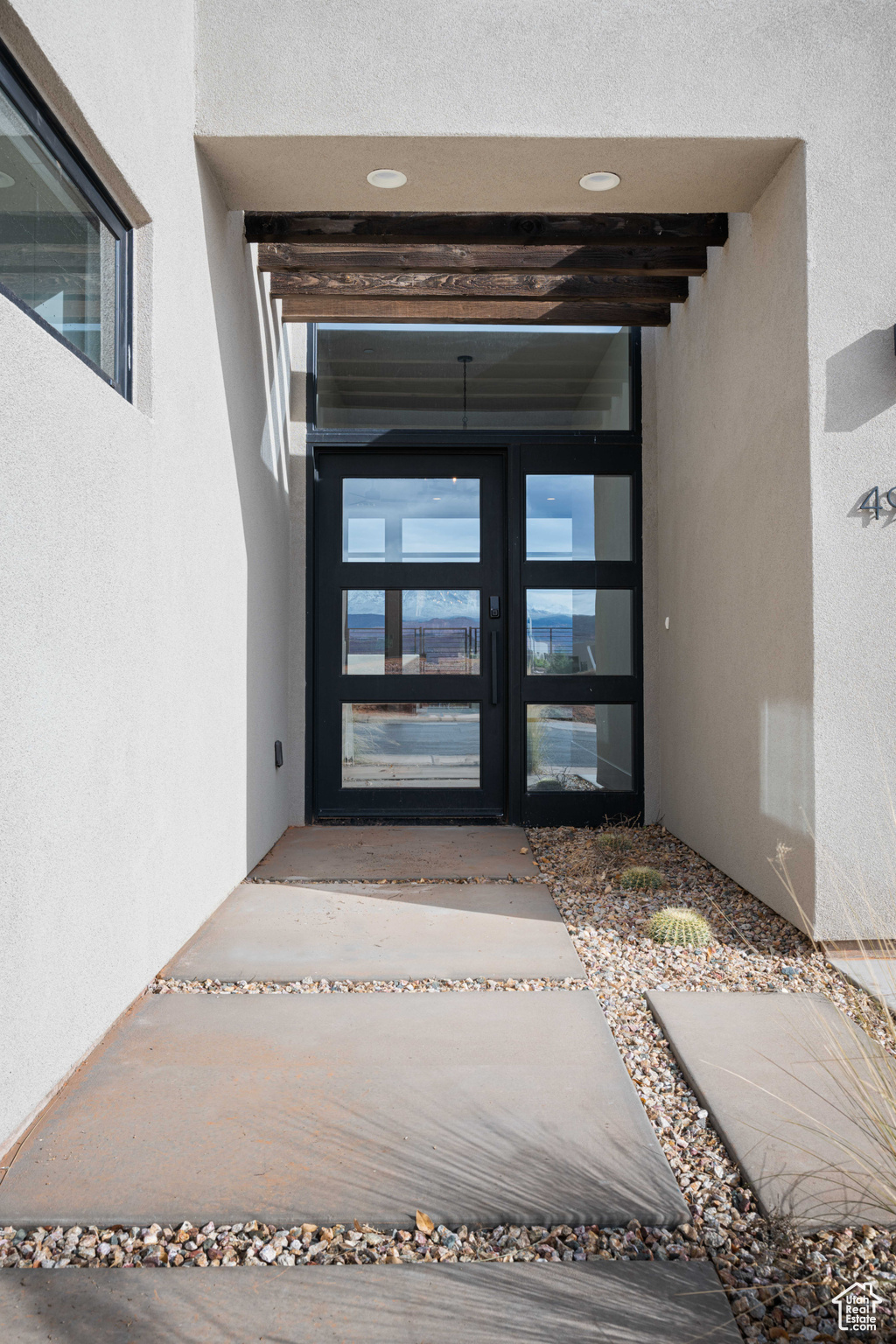 Property entrance featuring french doors