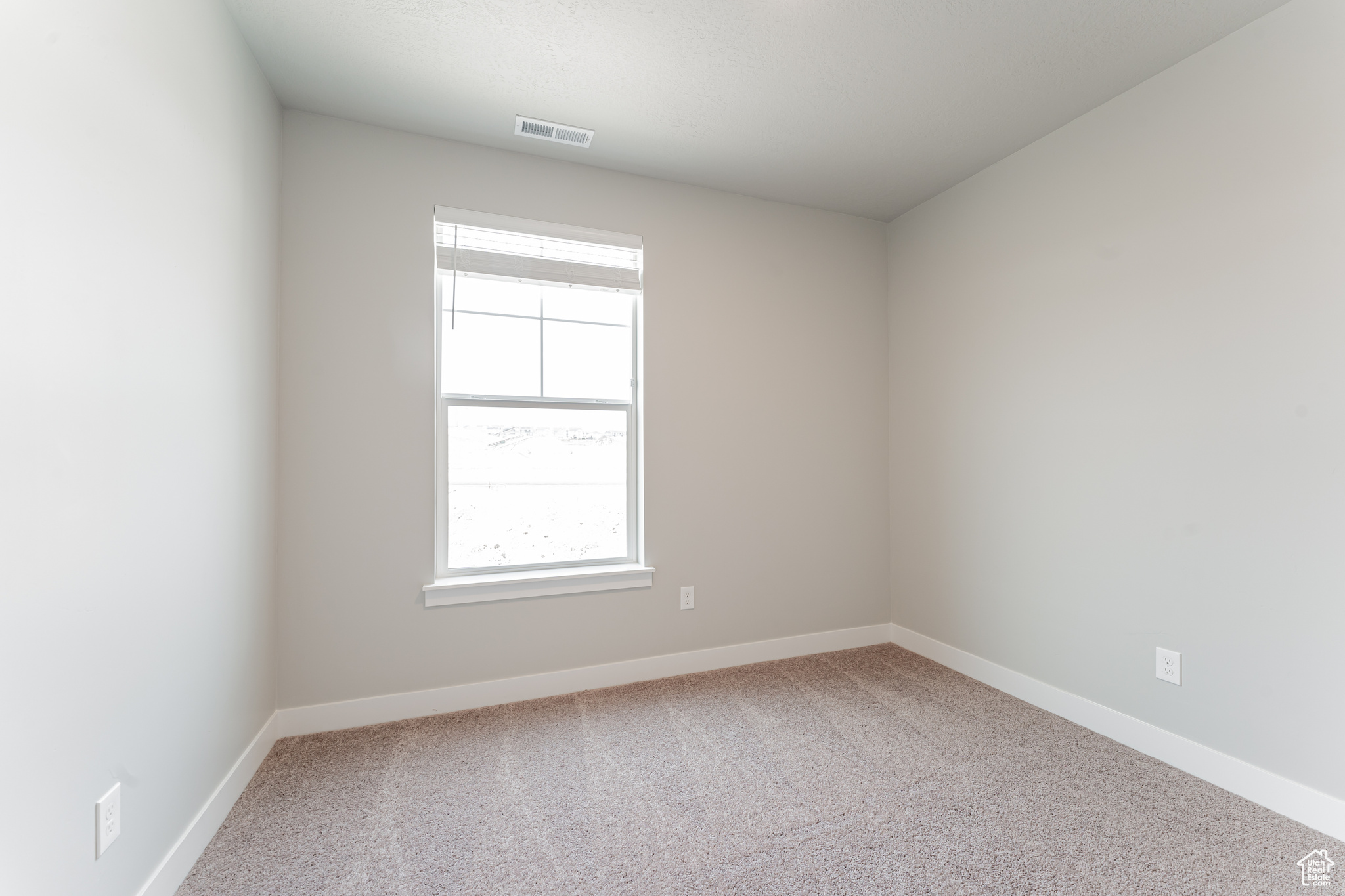 Empty room with carpet floors