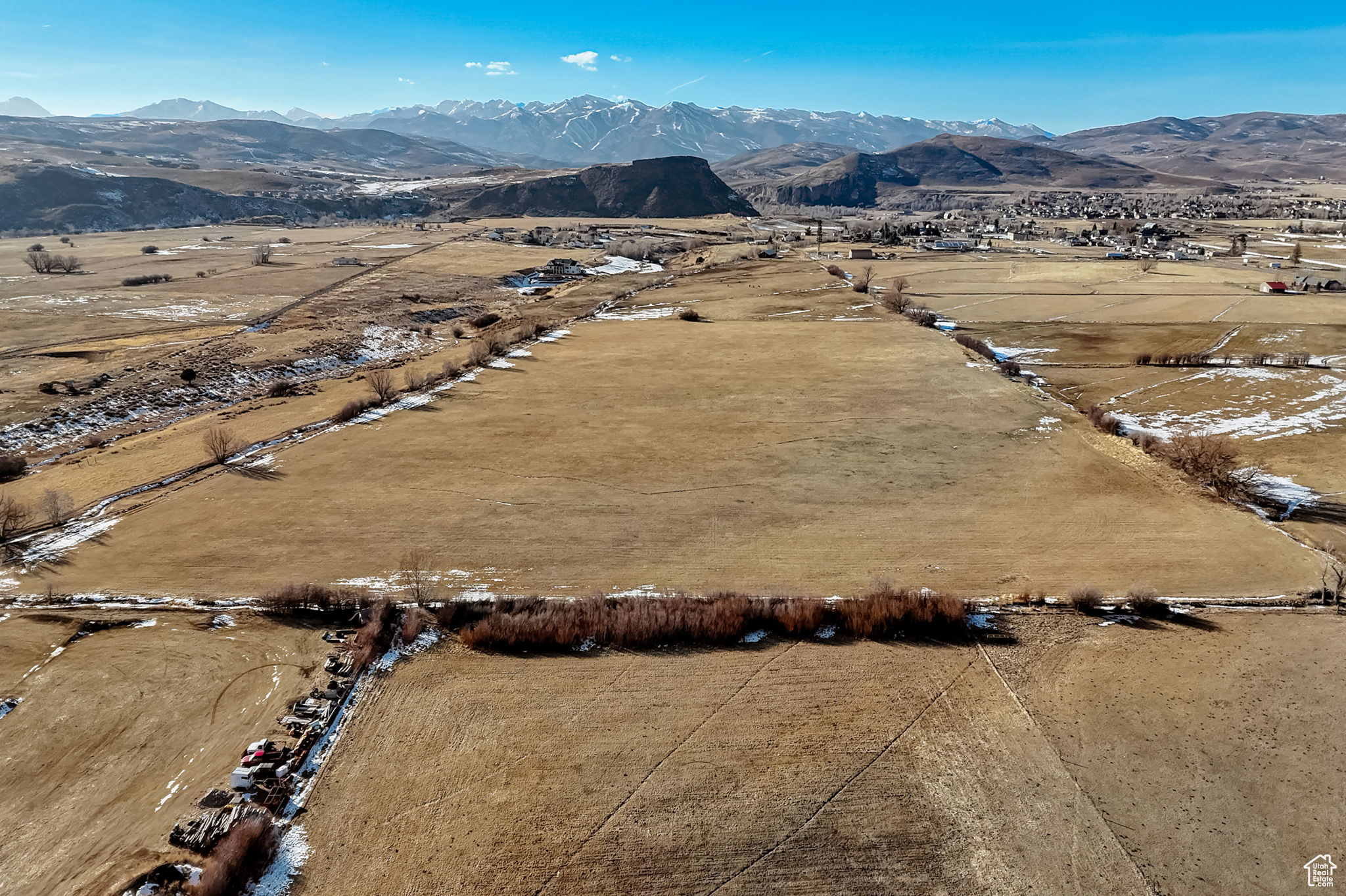 Birds eye view of property with a mountain view and a rural view