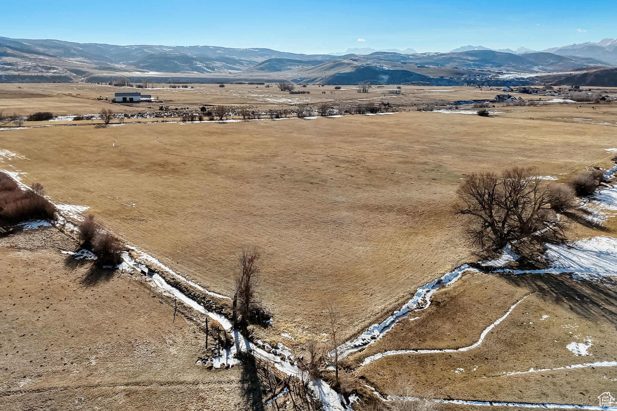 Birds eye view of property with a mountain view and a rural view