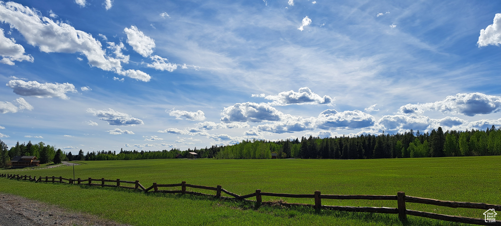 Exterior space featuring a rural view and a lawn