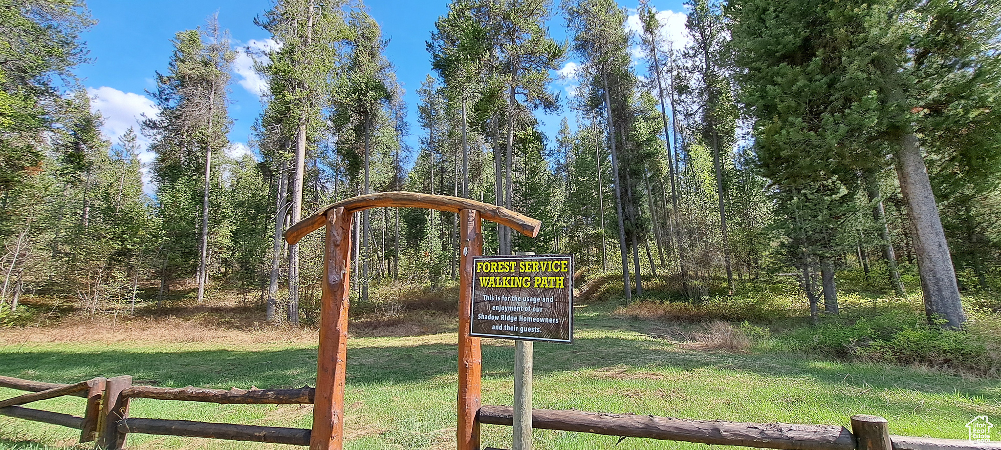 Community sign featuring a lawn