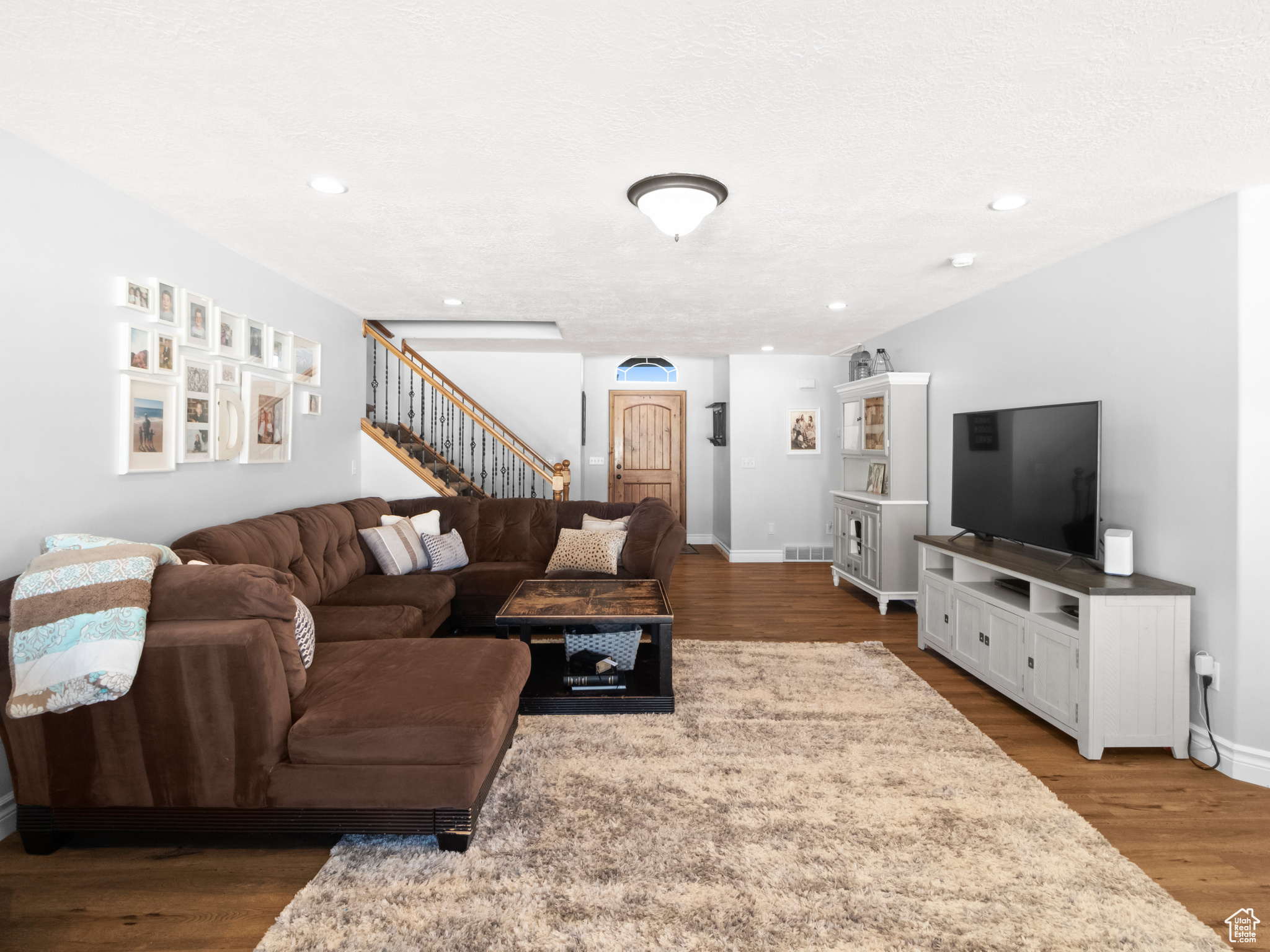 Living room featuring dark hardwood / wood-style flooring