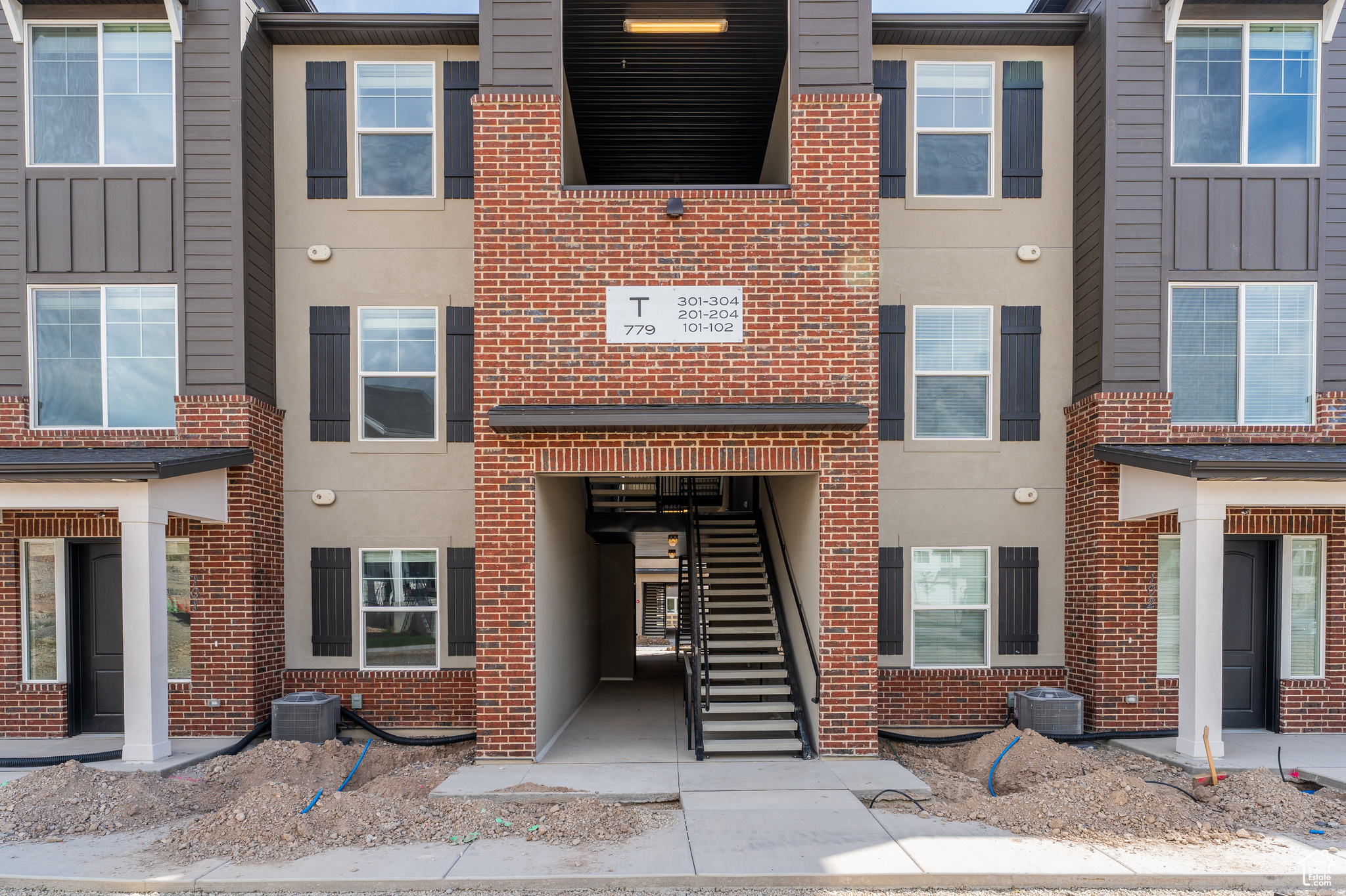 View of front of home featuring central air condition unit