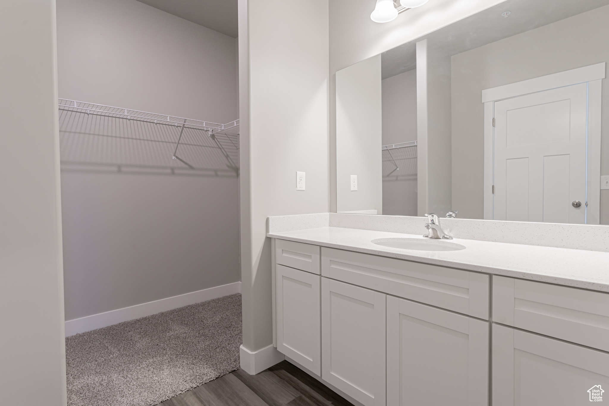 Bathroom featuring vanity and hardwood / wood-style floors