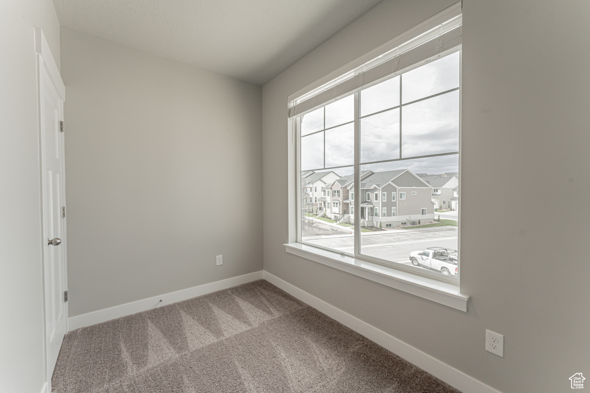 View of carpeted spare room