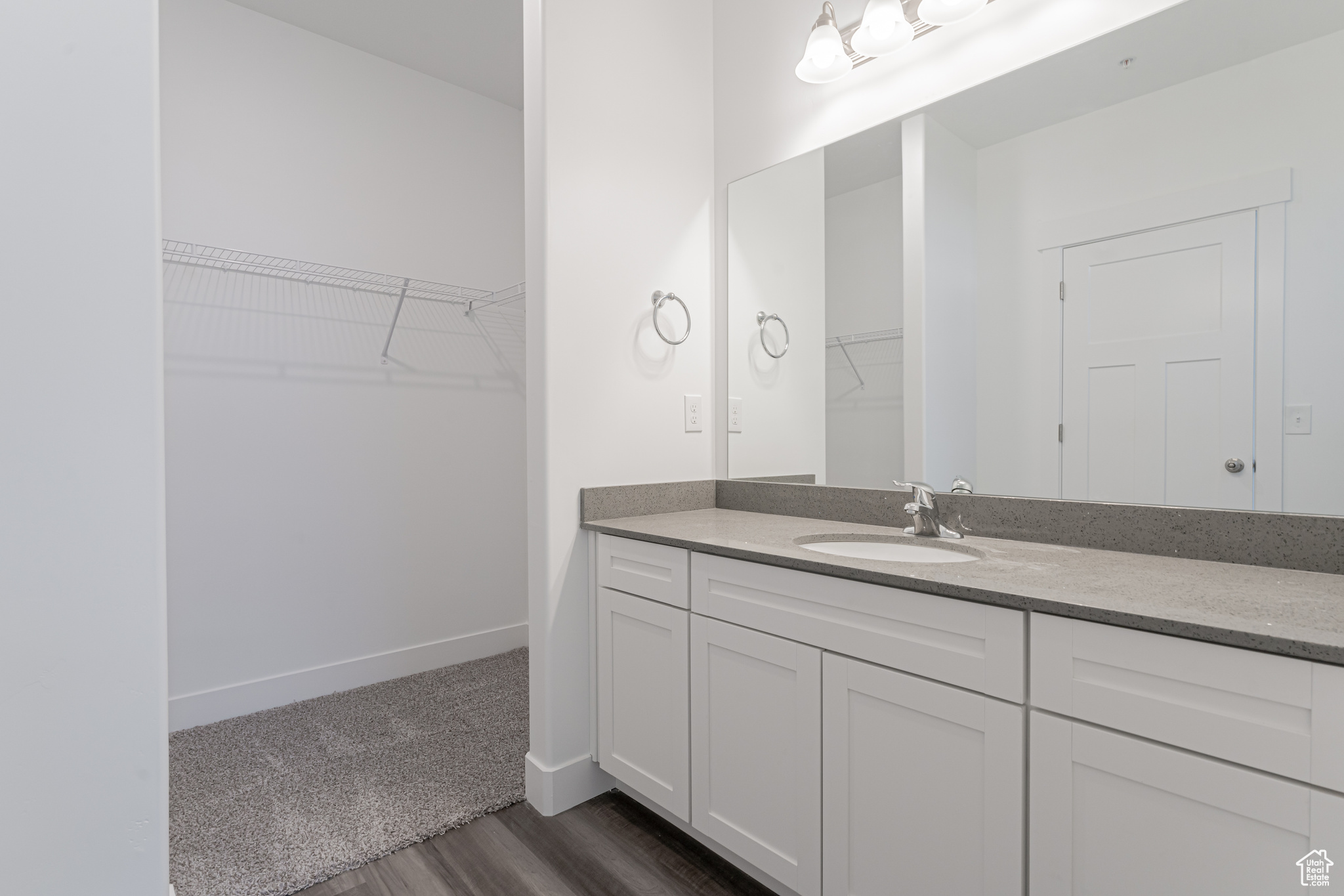 Bathroom featuring hardwood / wood-style floors and vanity