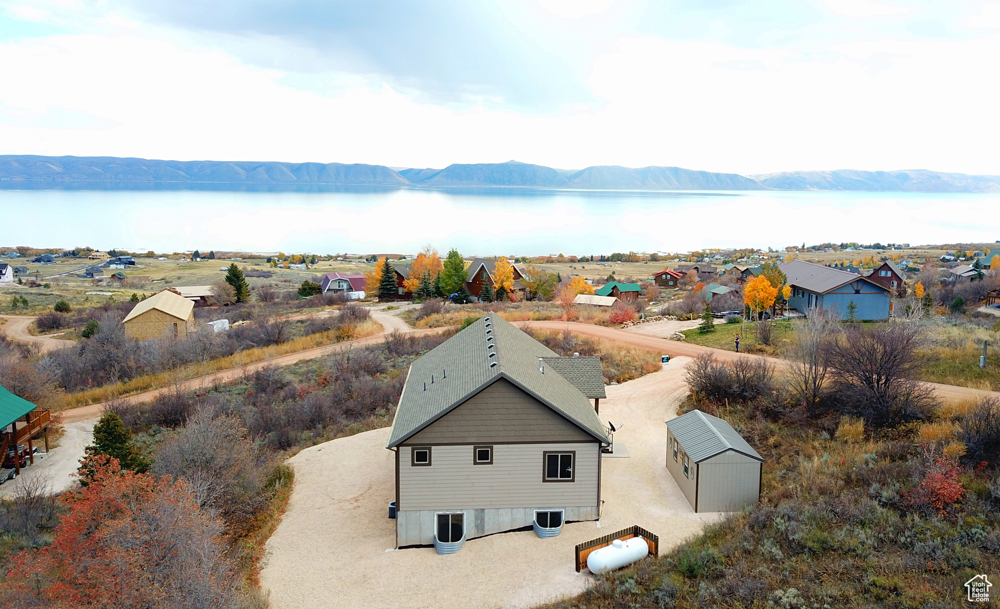 Drone / aerial view with a water and mountain view