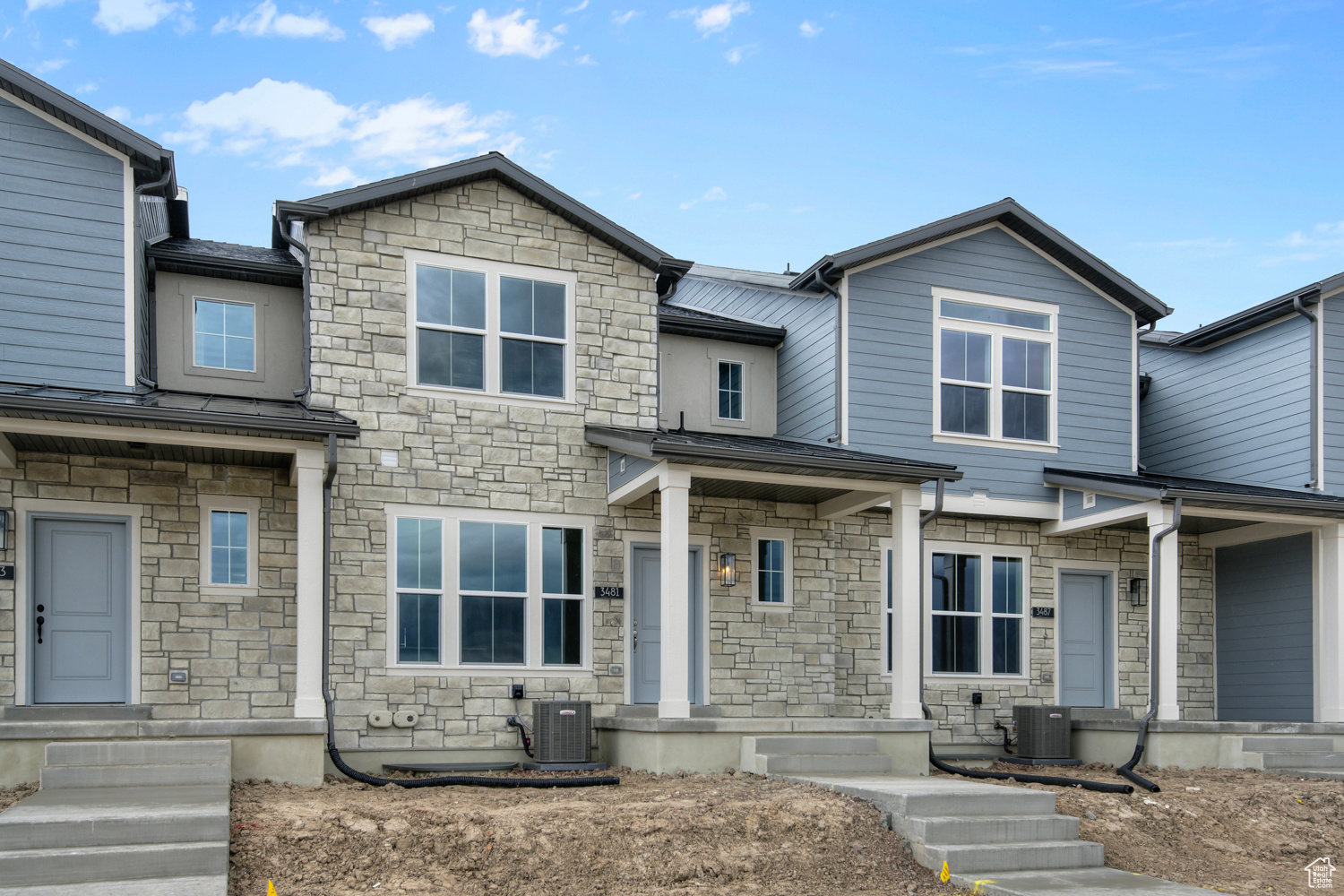 View of front of property featuring central AC