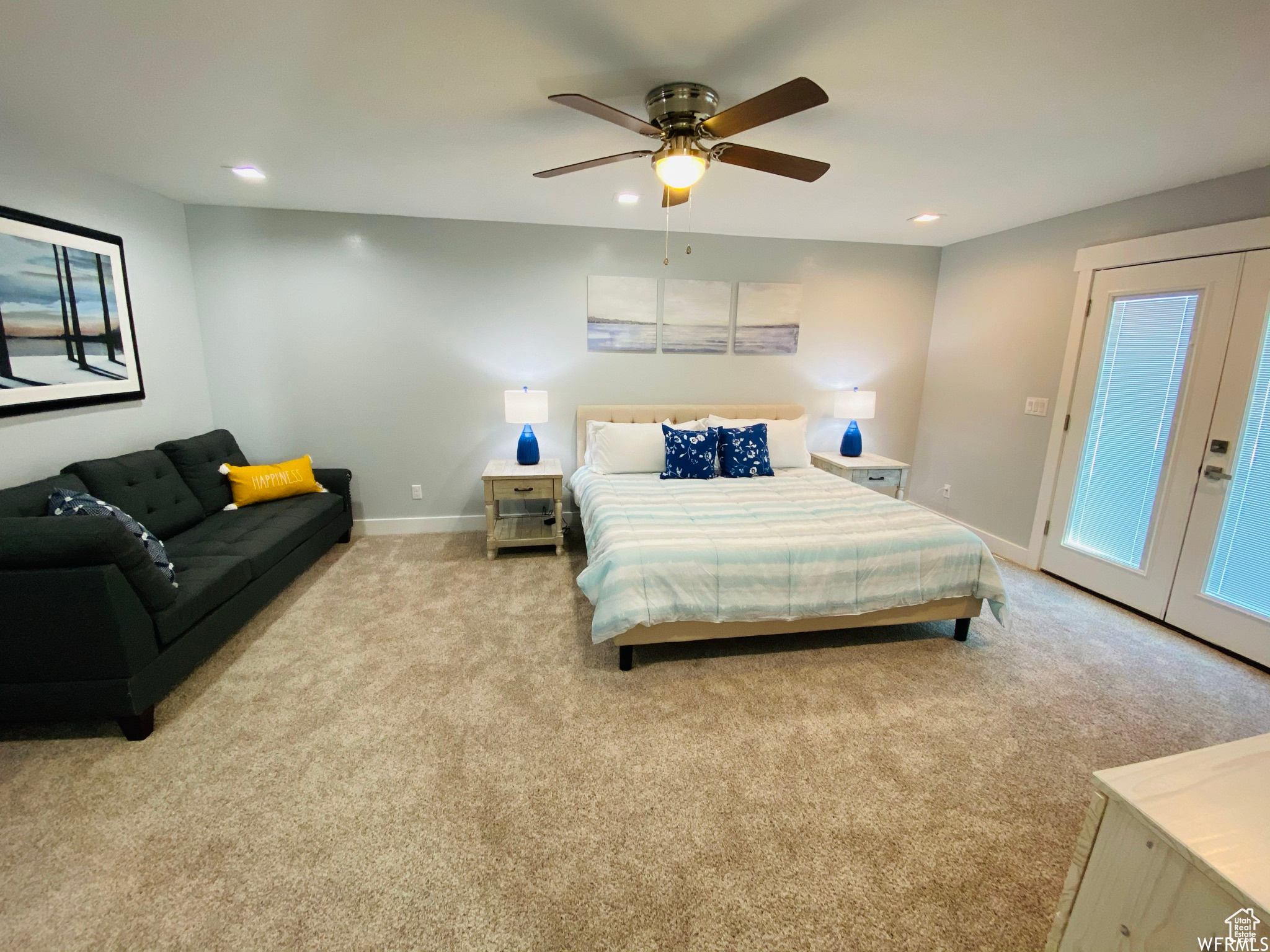 Bedroom with access to outside, light colored carpet, french doors, and ceiling fan