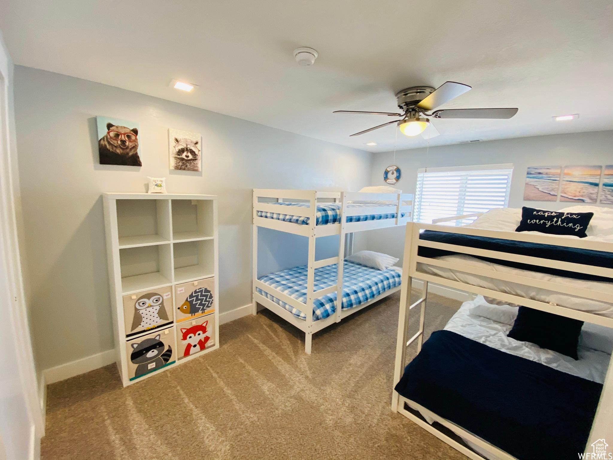 Bedroom with dark carpet and ceiling fan