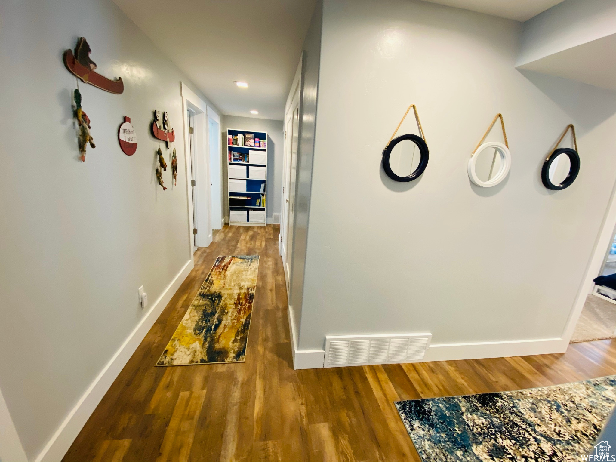 Corridor featuring hardwood / wood-style floors