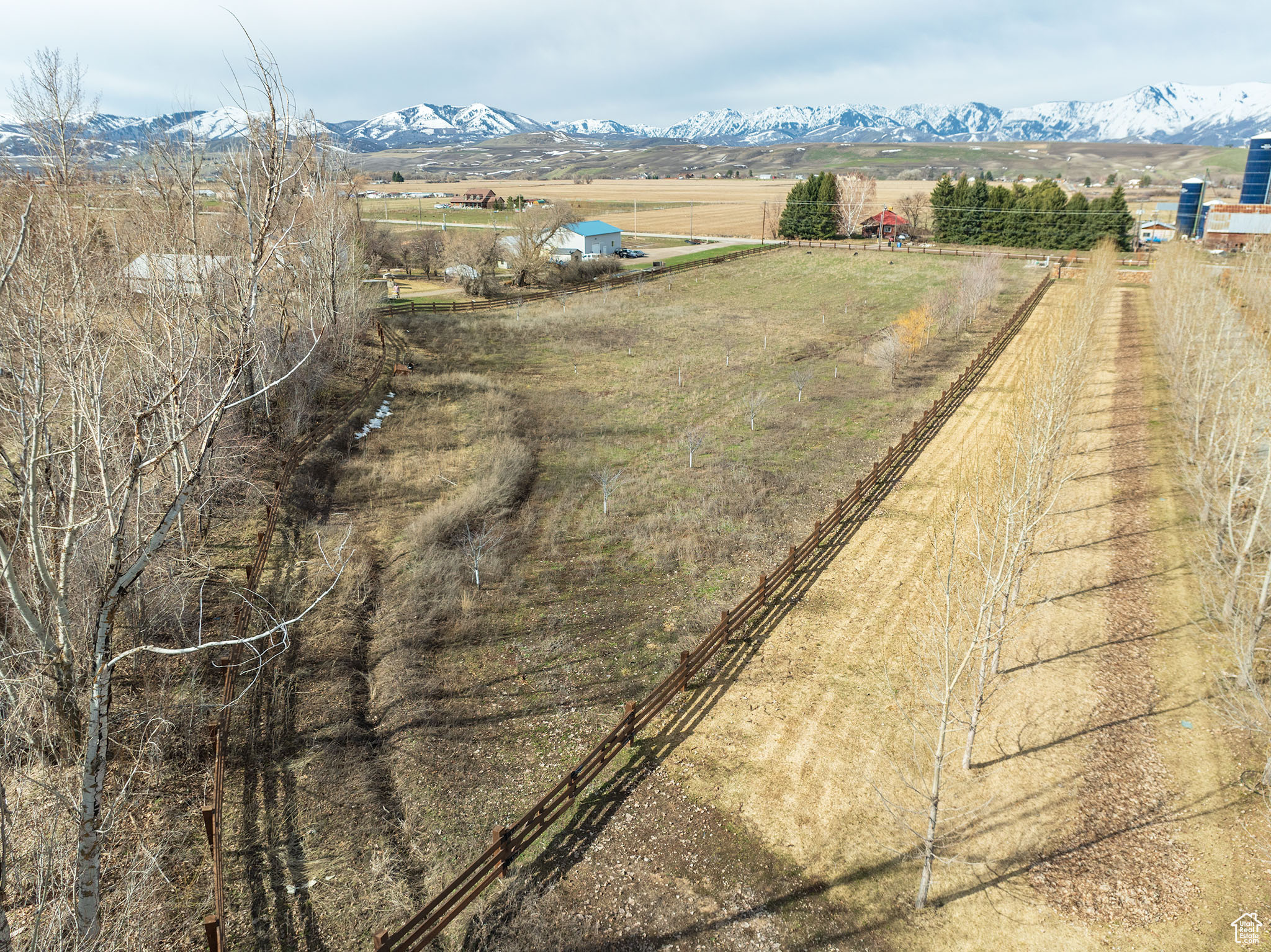 Birds eye view of property with a mountain view and a rural view