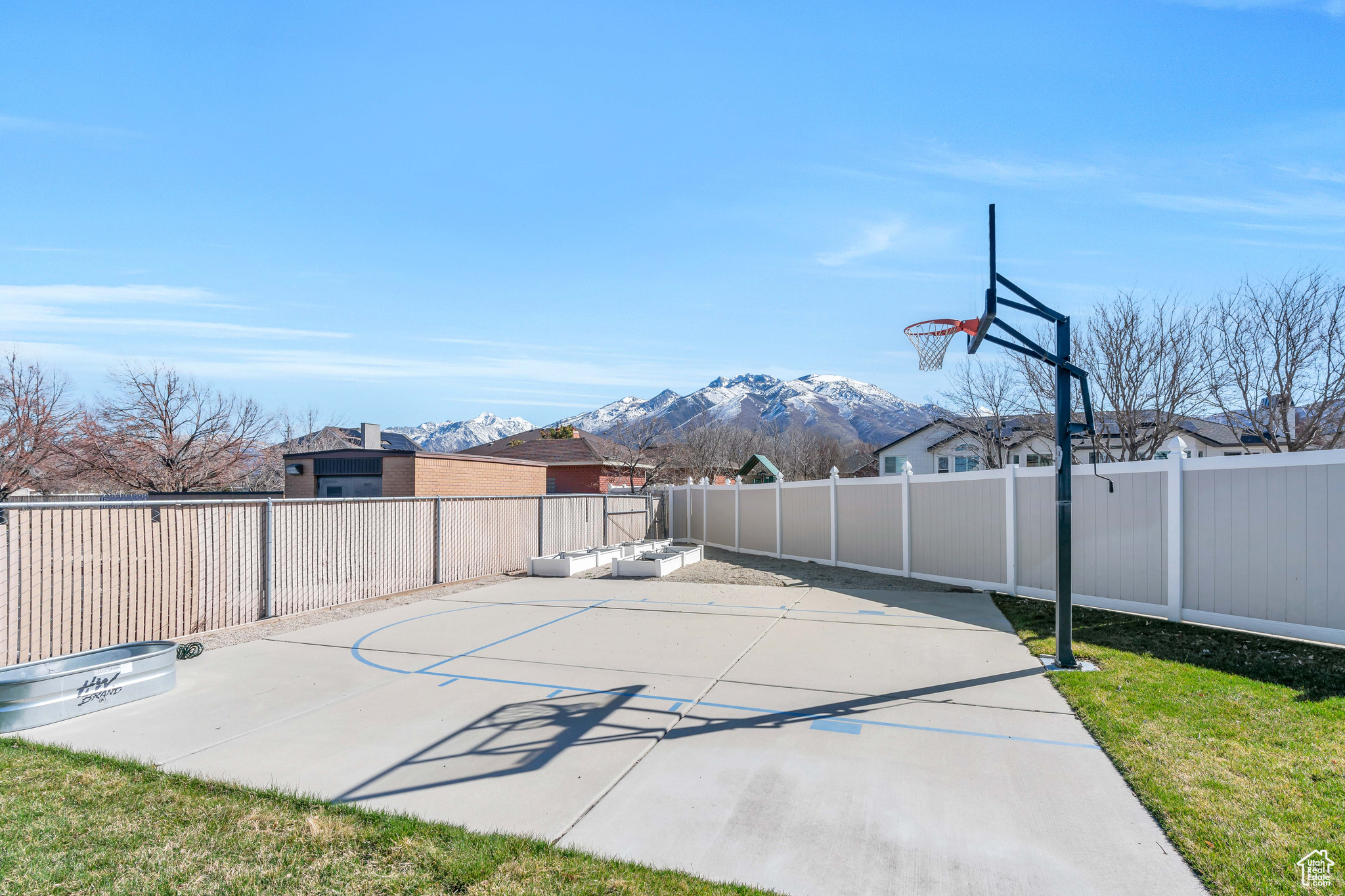 Basketball court/RV parking (gates open to allow parking)