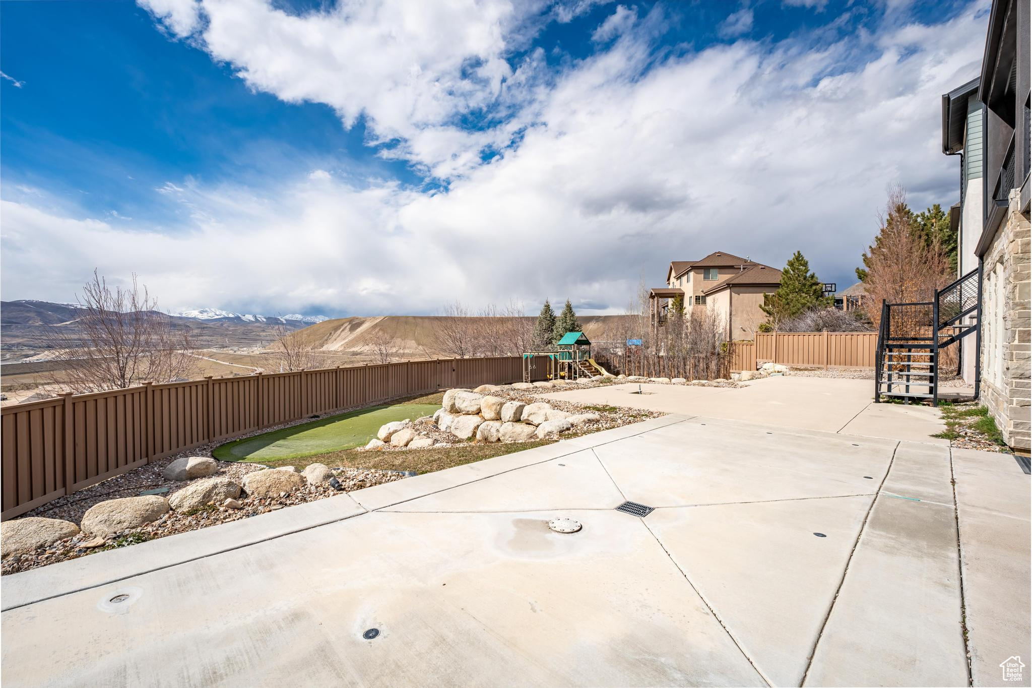 View of yard with a patio area and a playground