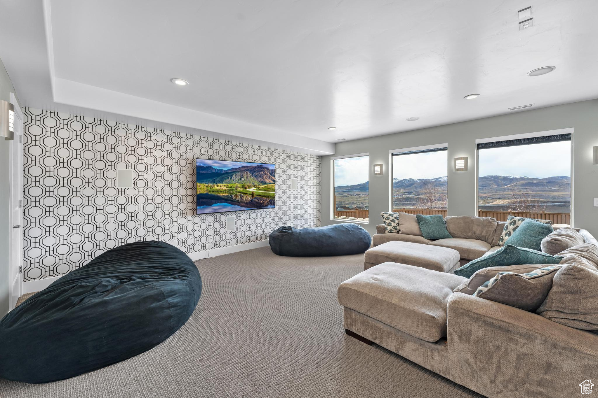 Carpeted living room with a mountain view