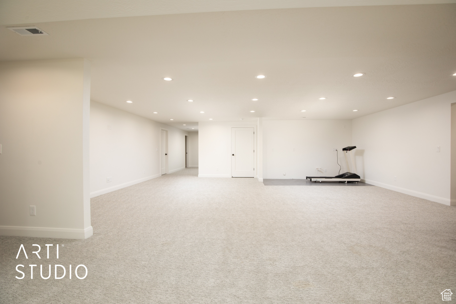 Interior space featuring light carpet