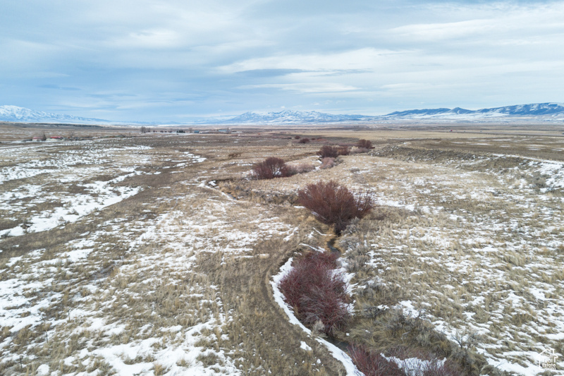 Snowy aerial view with a mountain view