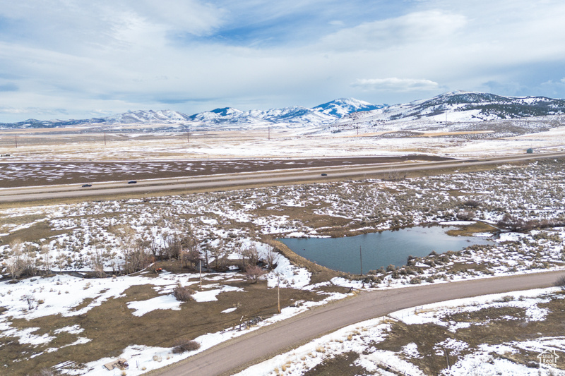 Snowy aerial view featuring a mountain view