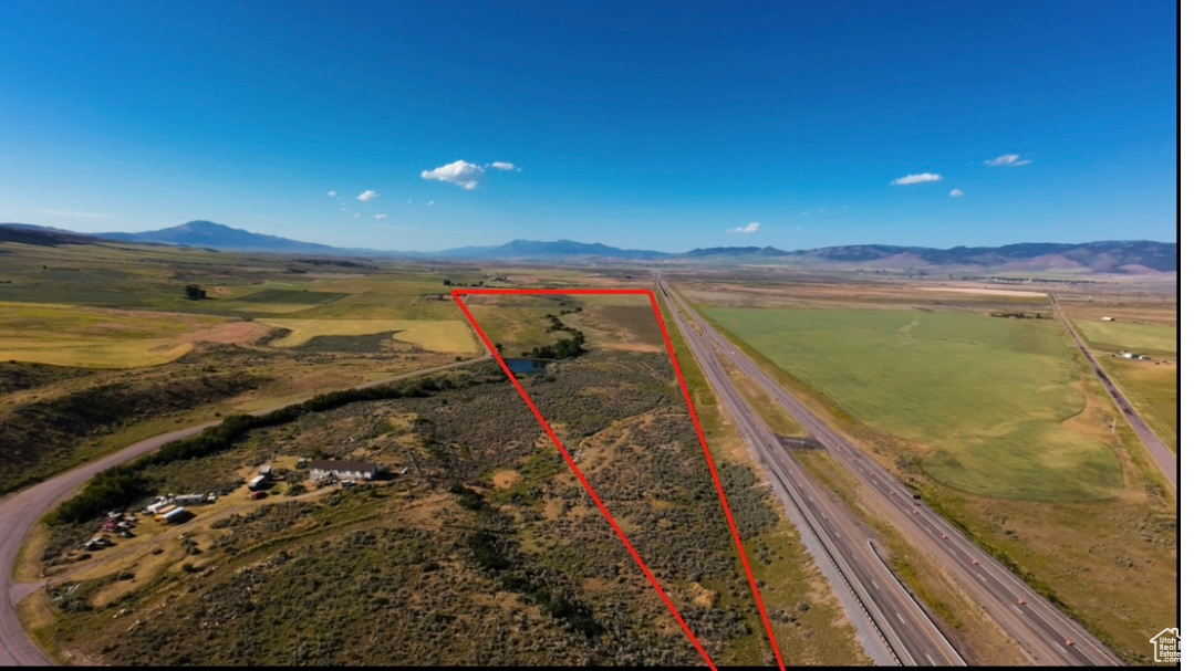 Aerial view featuring a mountain view and a rural view