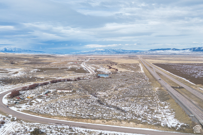 Snowy aerial view featuring a mountain view