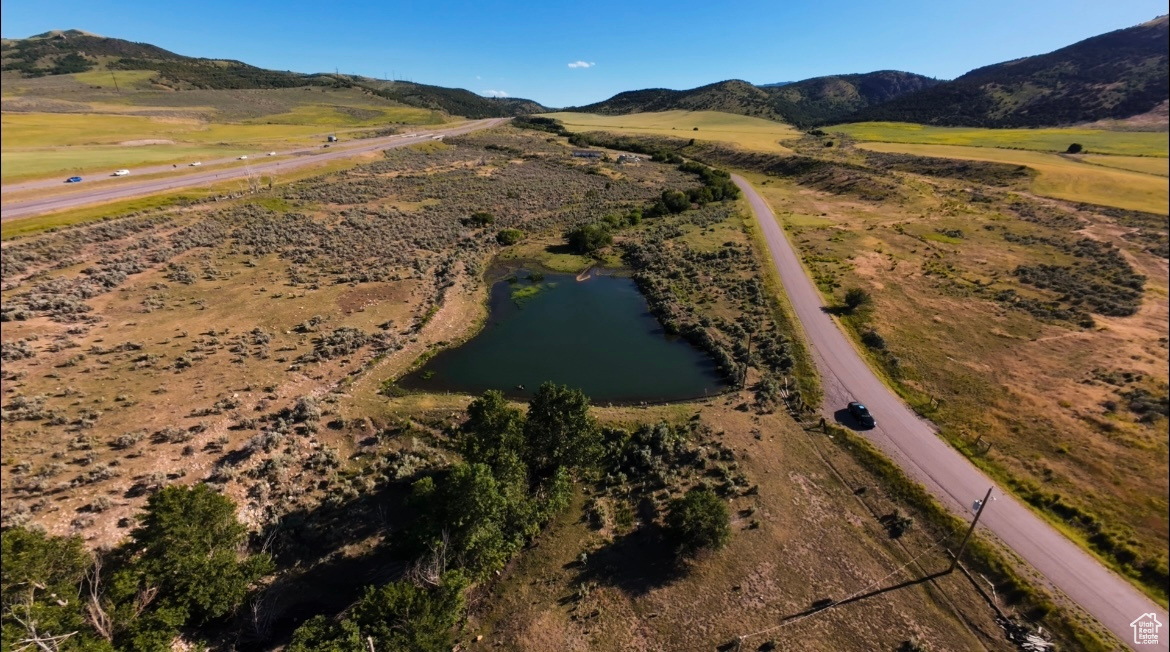 Bird's eye view featuring a water and mountain view