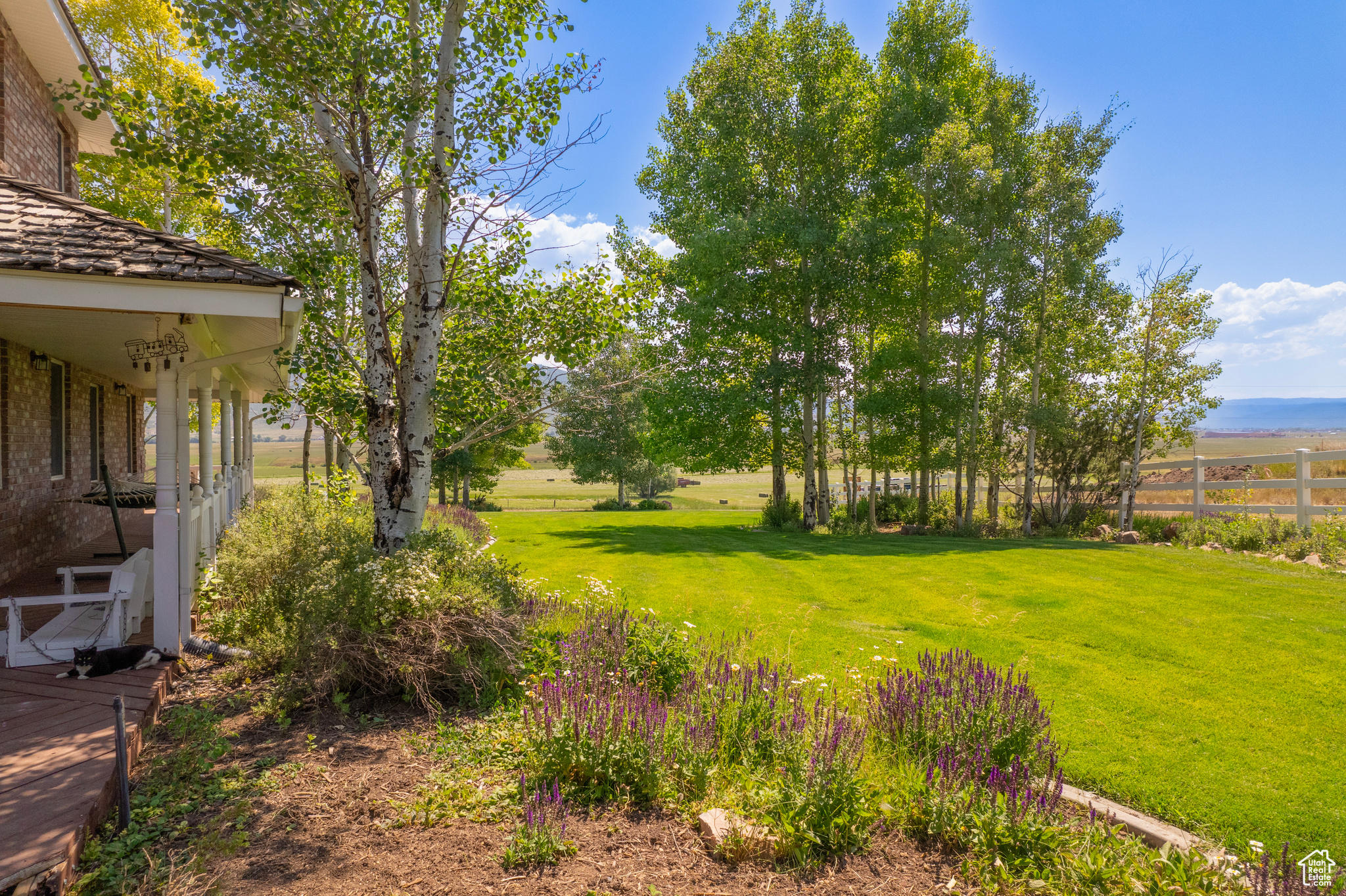 View of yard with a rural view