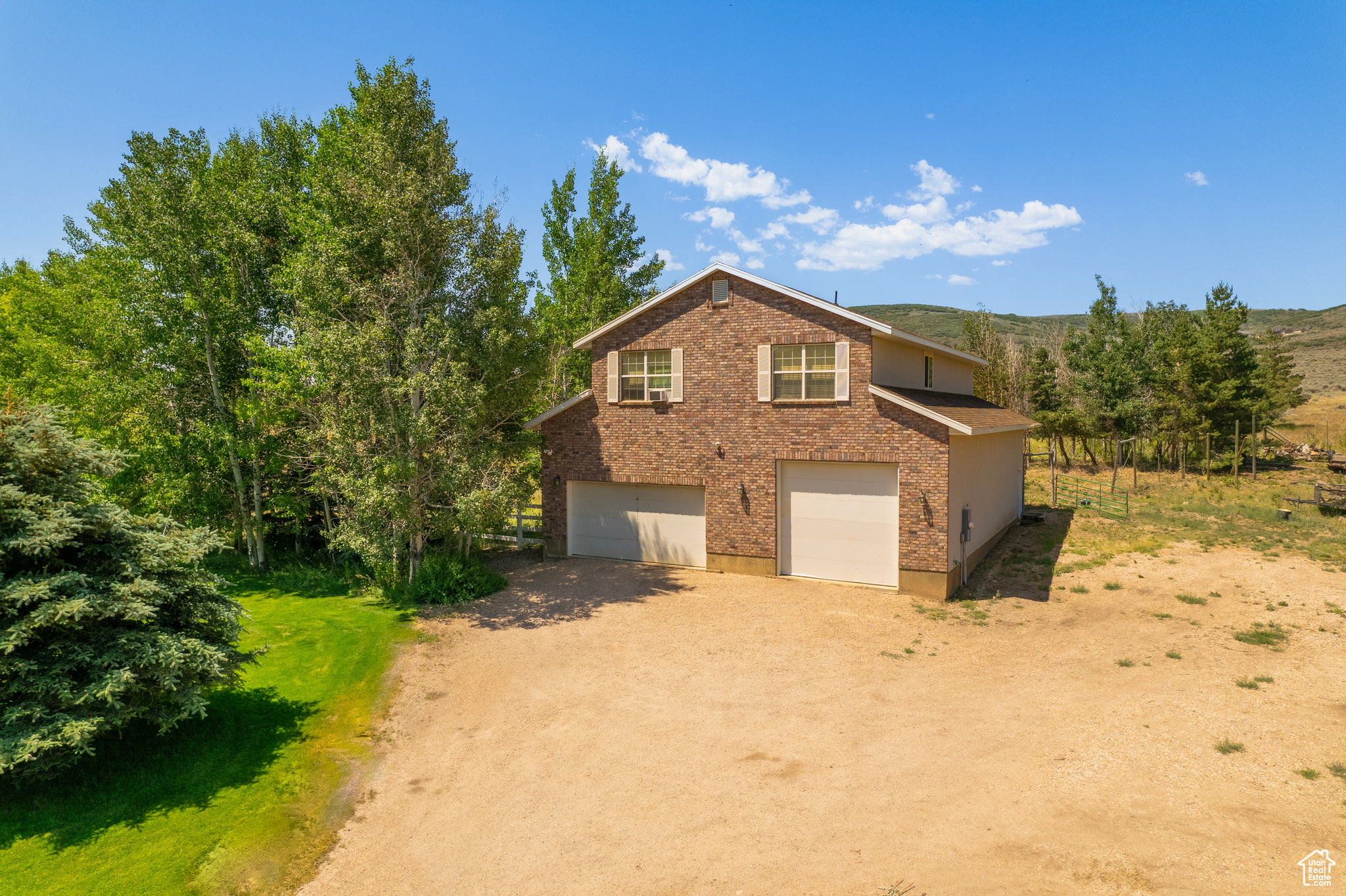 View of property exterior with a garage