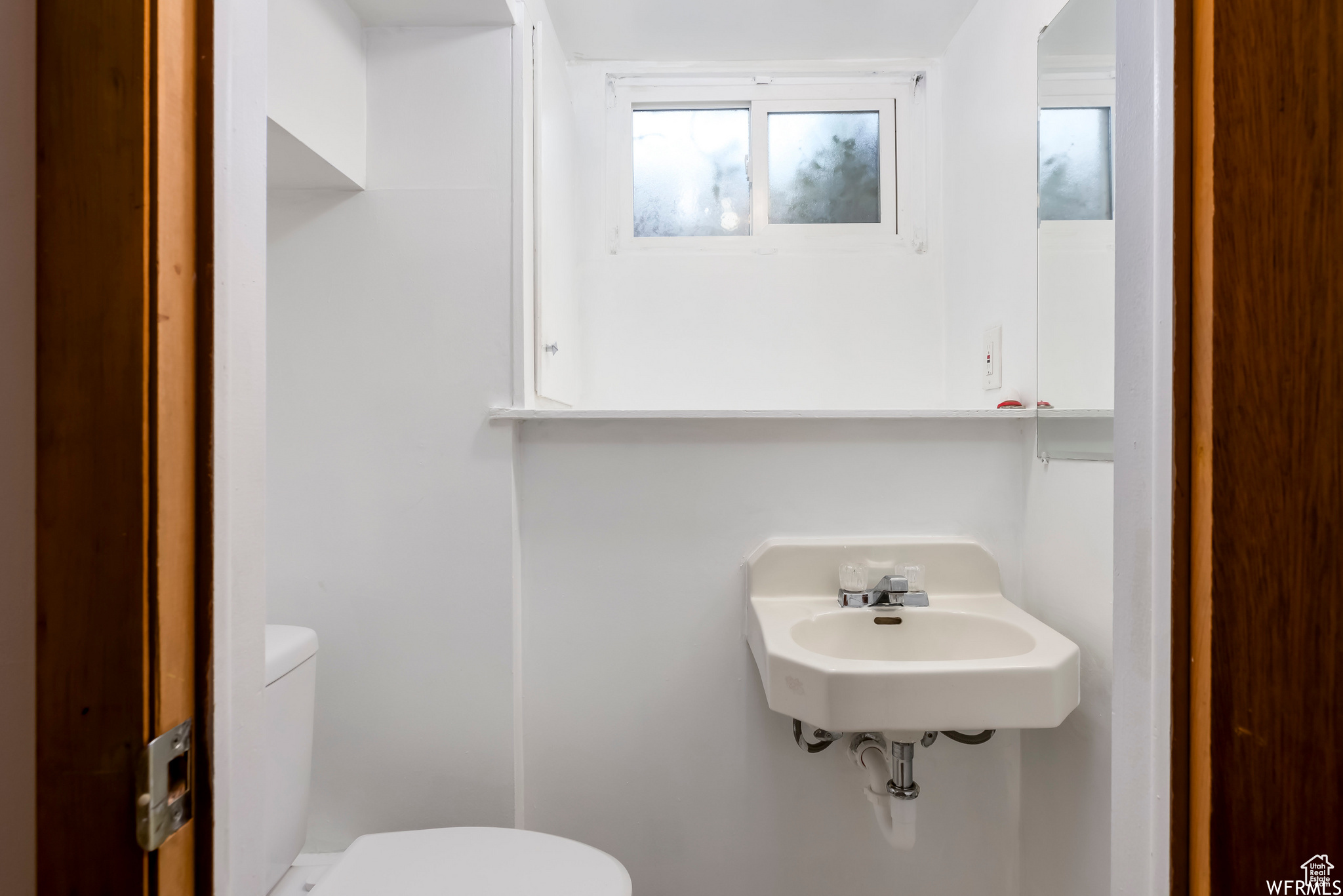 Bathroom featuring toilet and sink