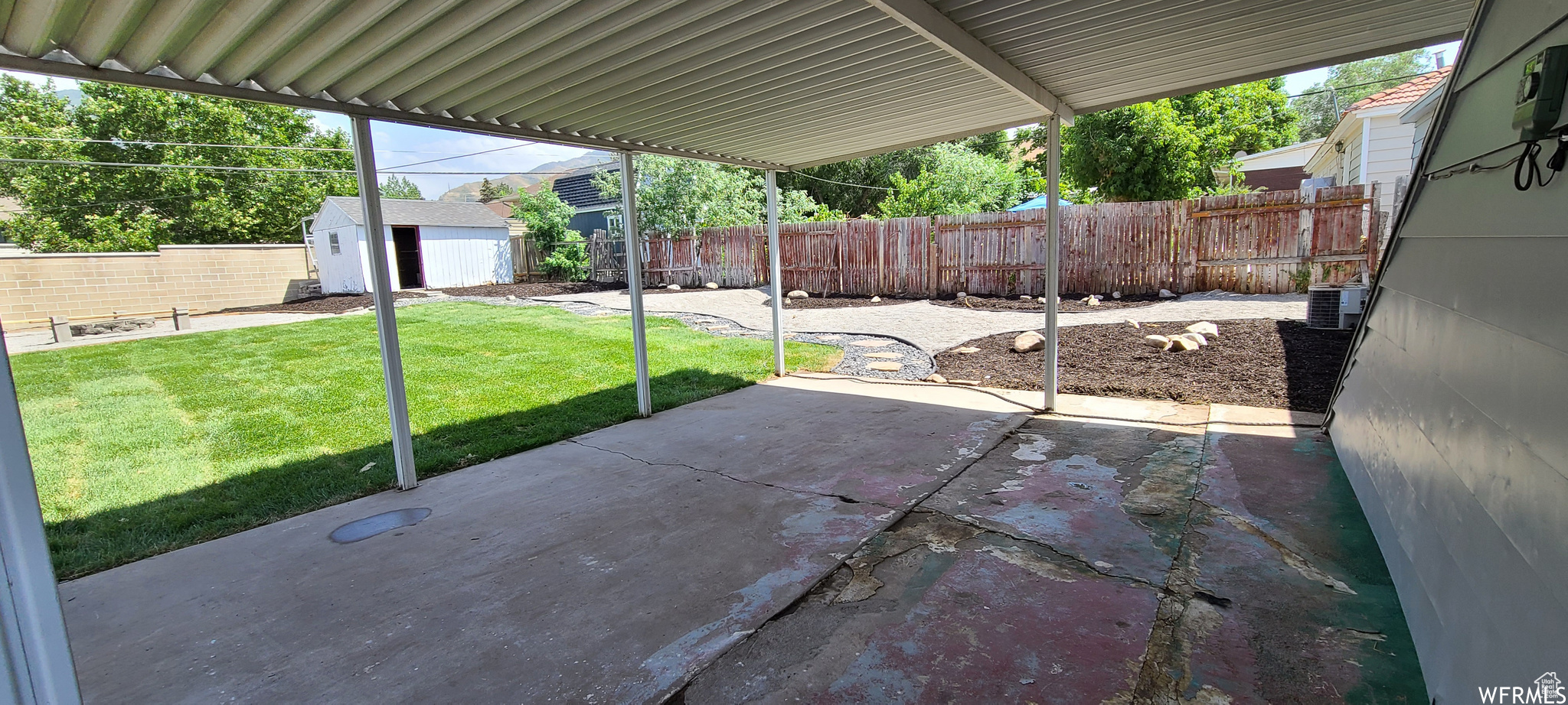 View of terrace featuring central air condition unit and a storage unit