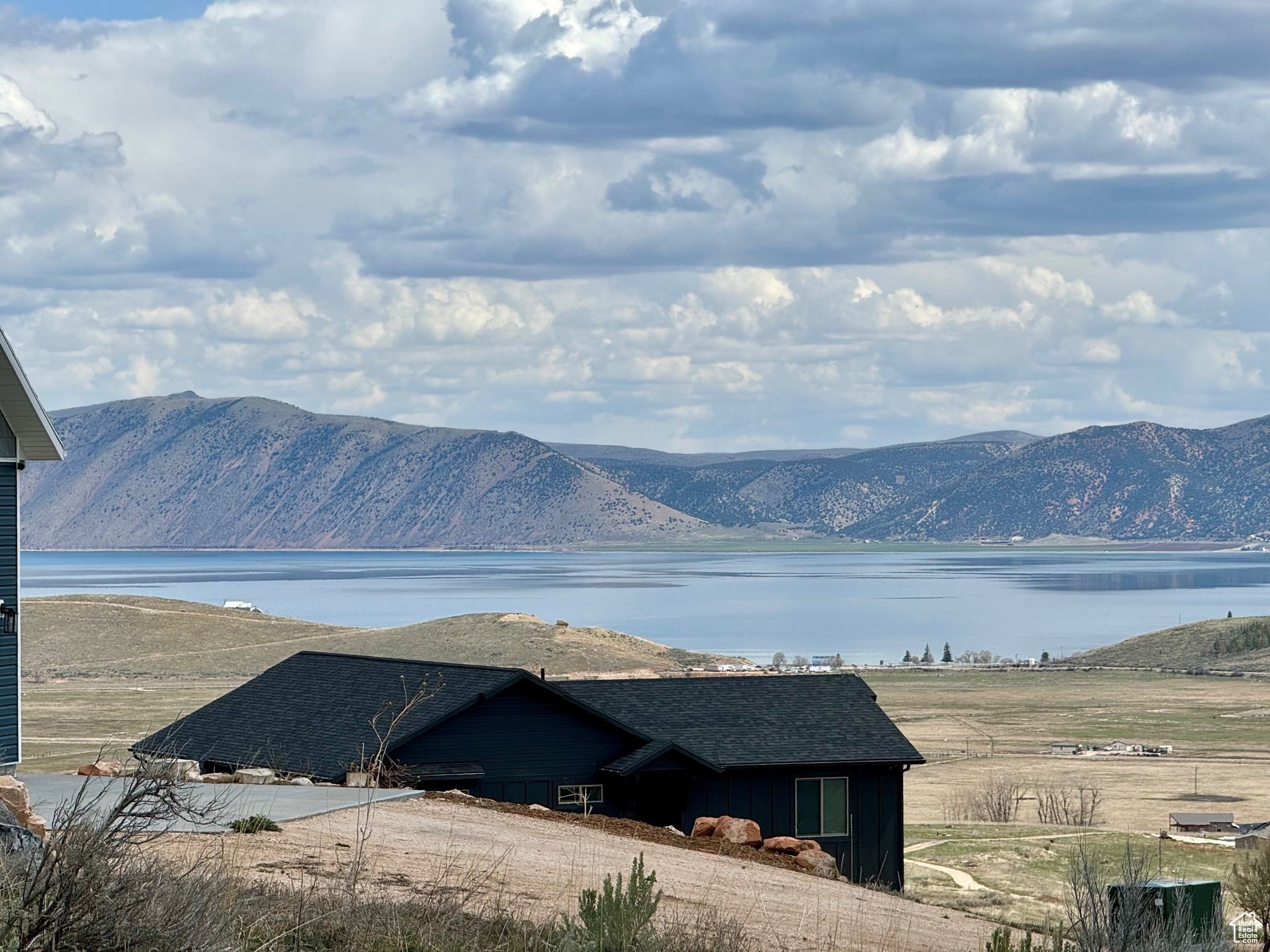 Property view of mountains with a water view