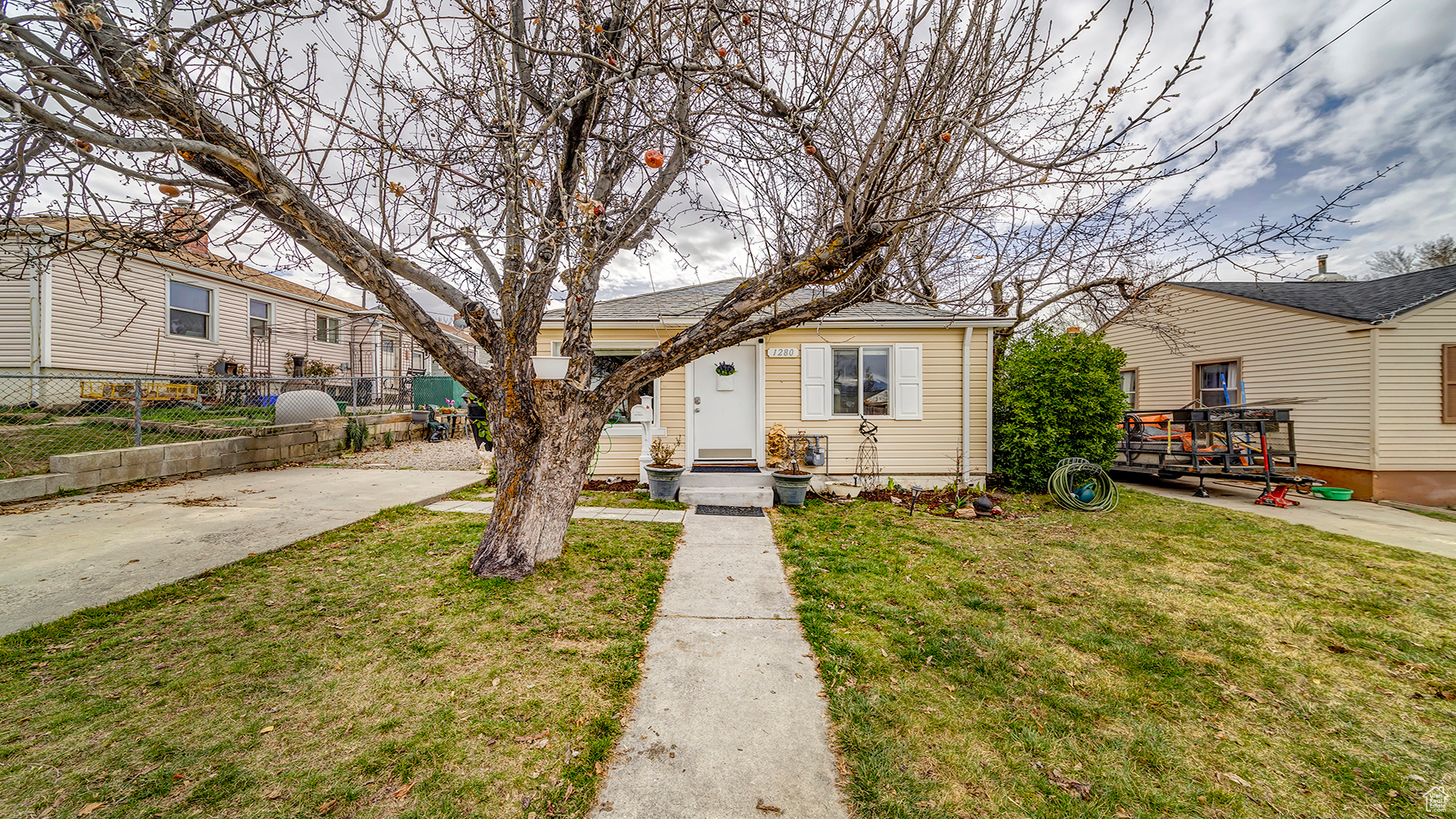 Bungalow-style home featuring a front yard