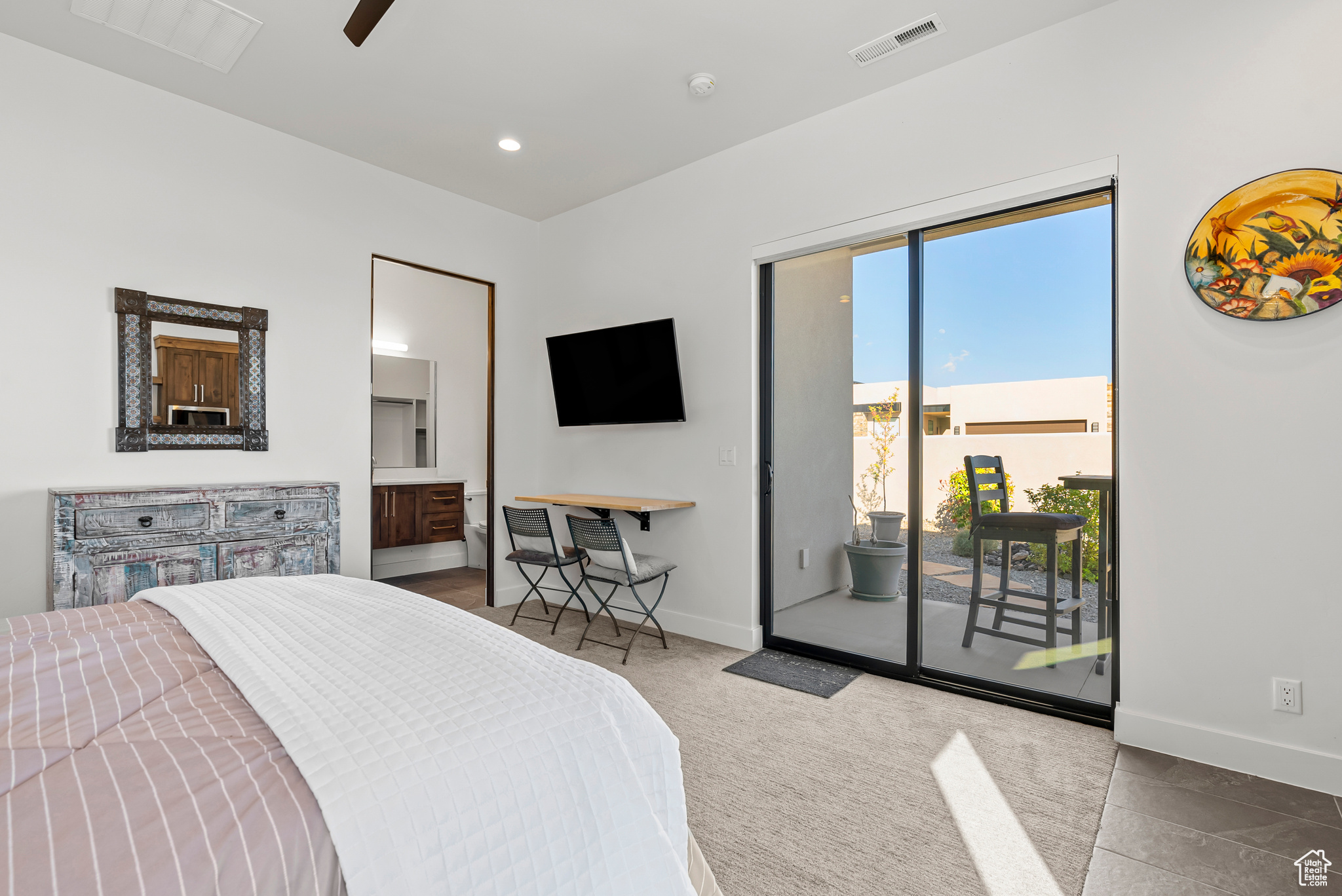 Bedroom featuring access to exterior, ceiling fan, and light tile floors, Casita