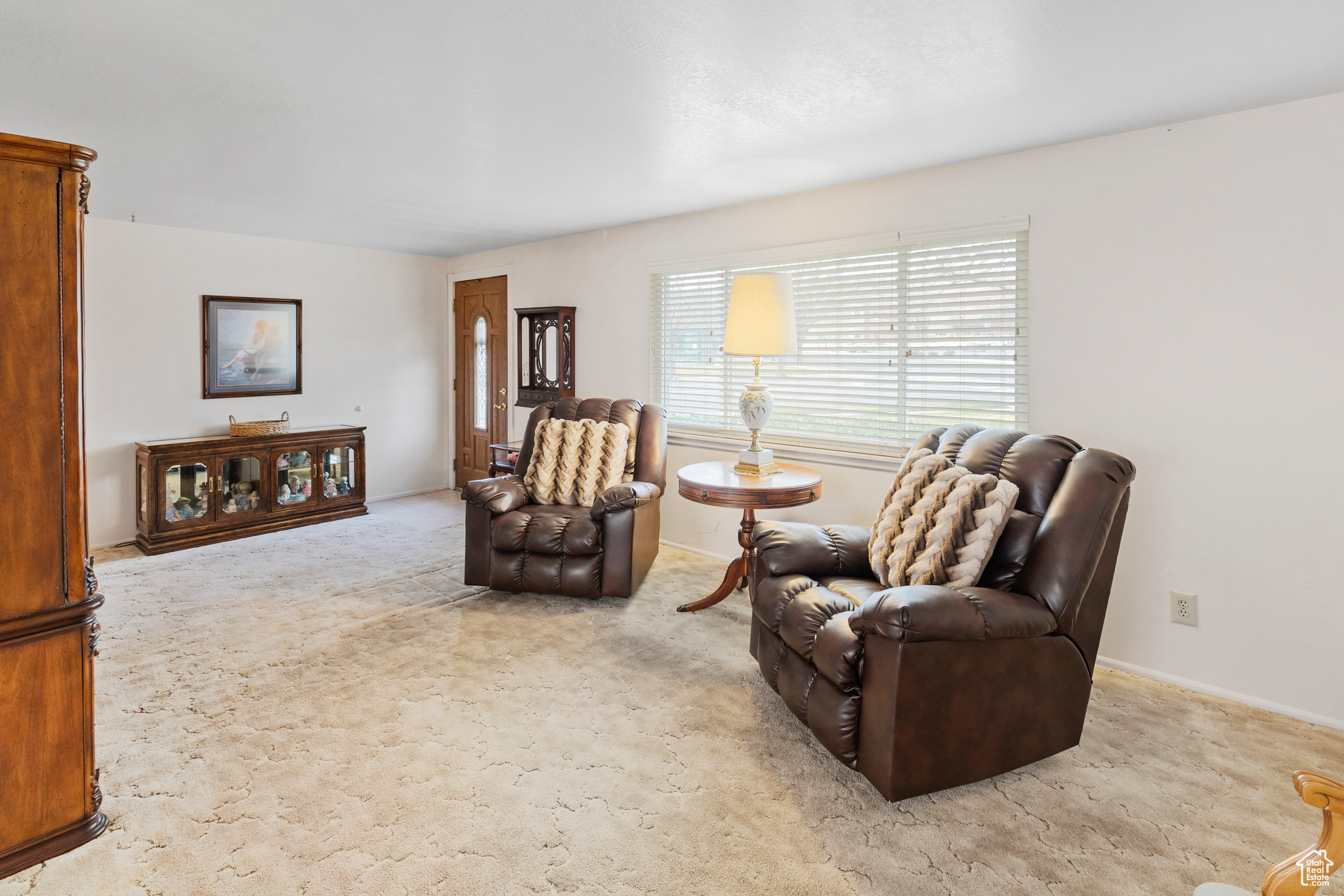 Living area with light colored carpet