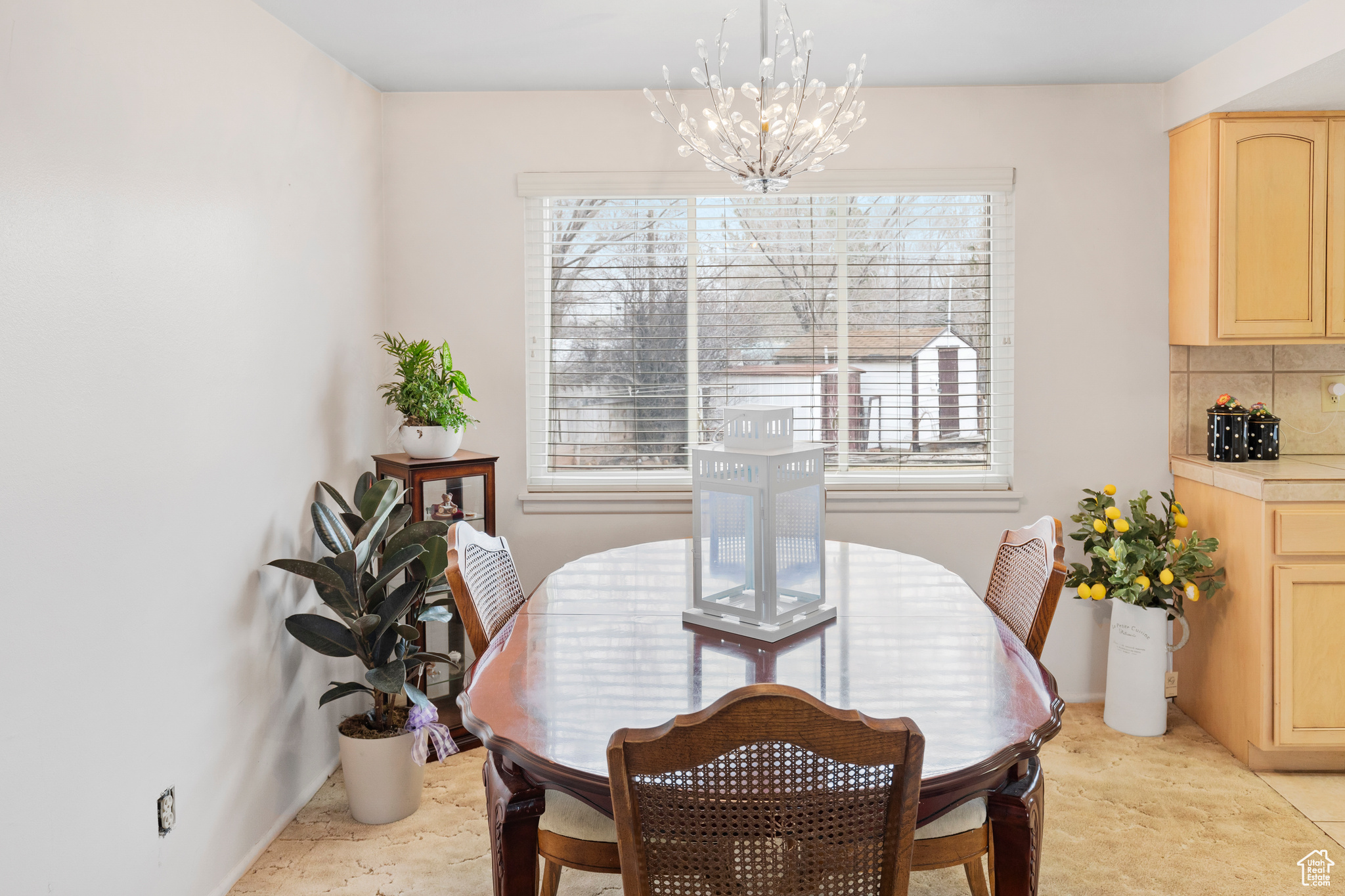 Dining space with a healthy amount of sunlight and a chandelier