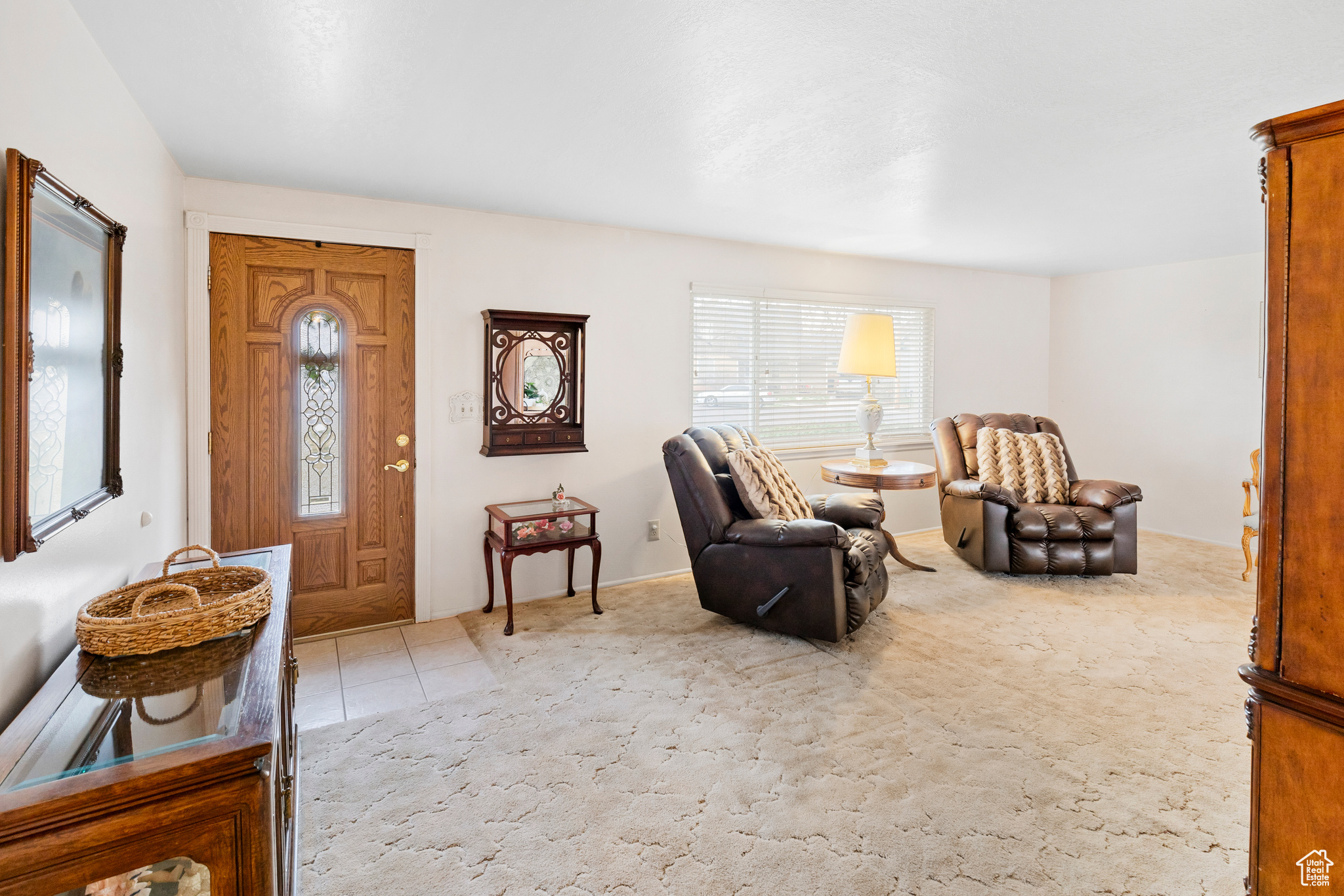 Living area featuring light colored carpet