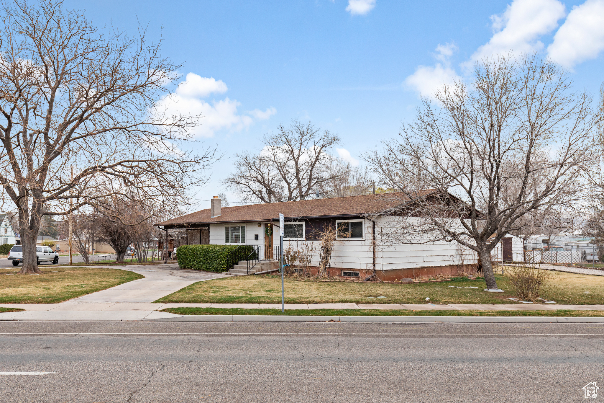 Single story home featuring a front lawn