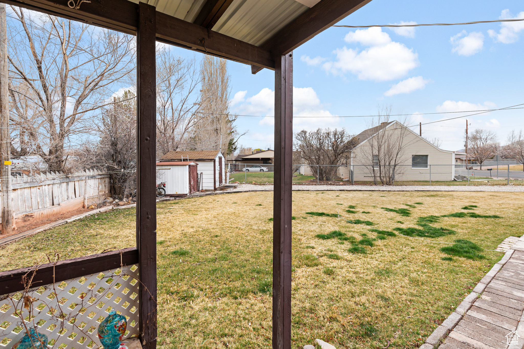 View of yard featuring a storage unit