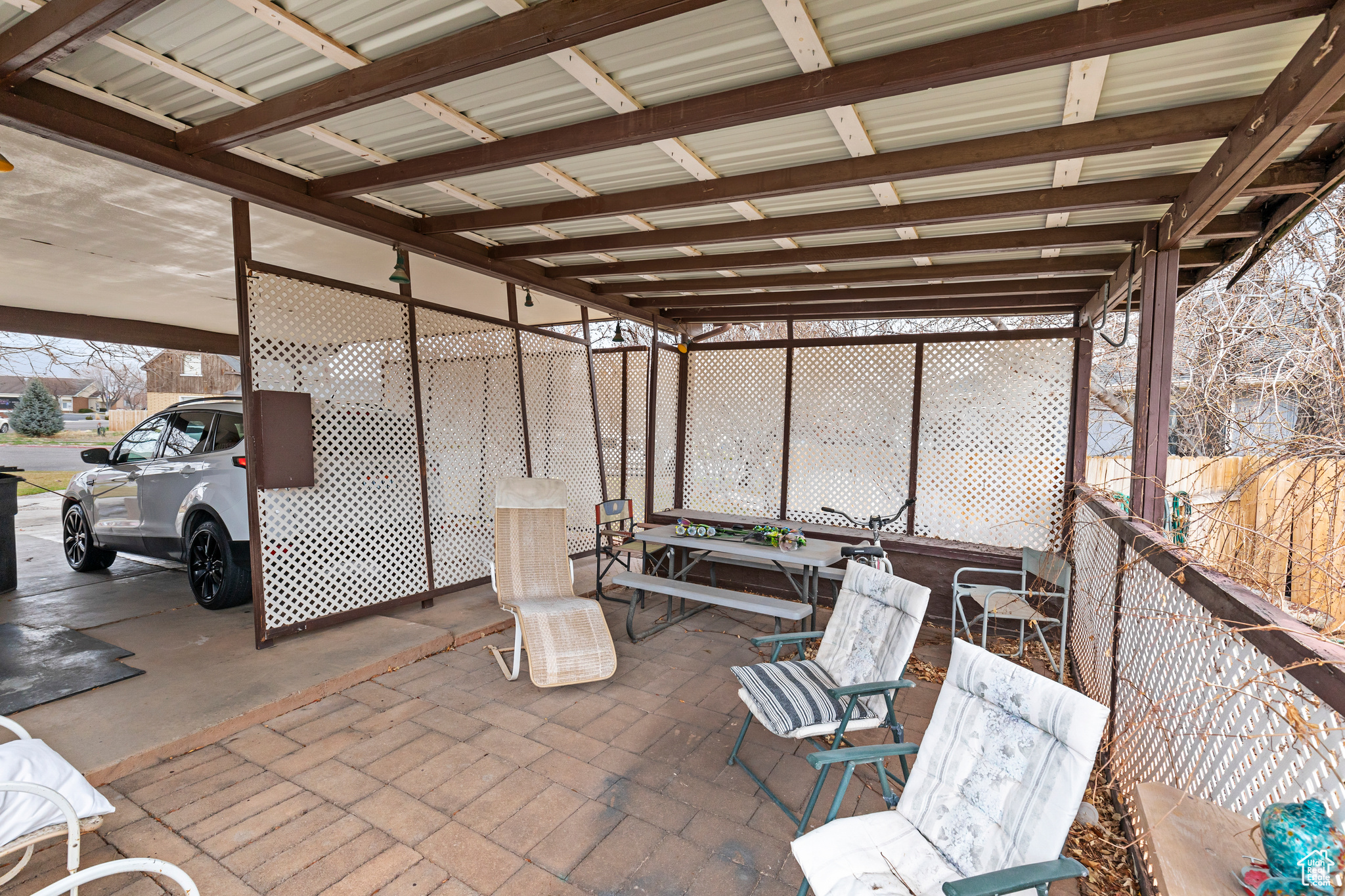 View of terrace with a carport