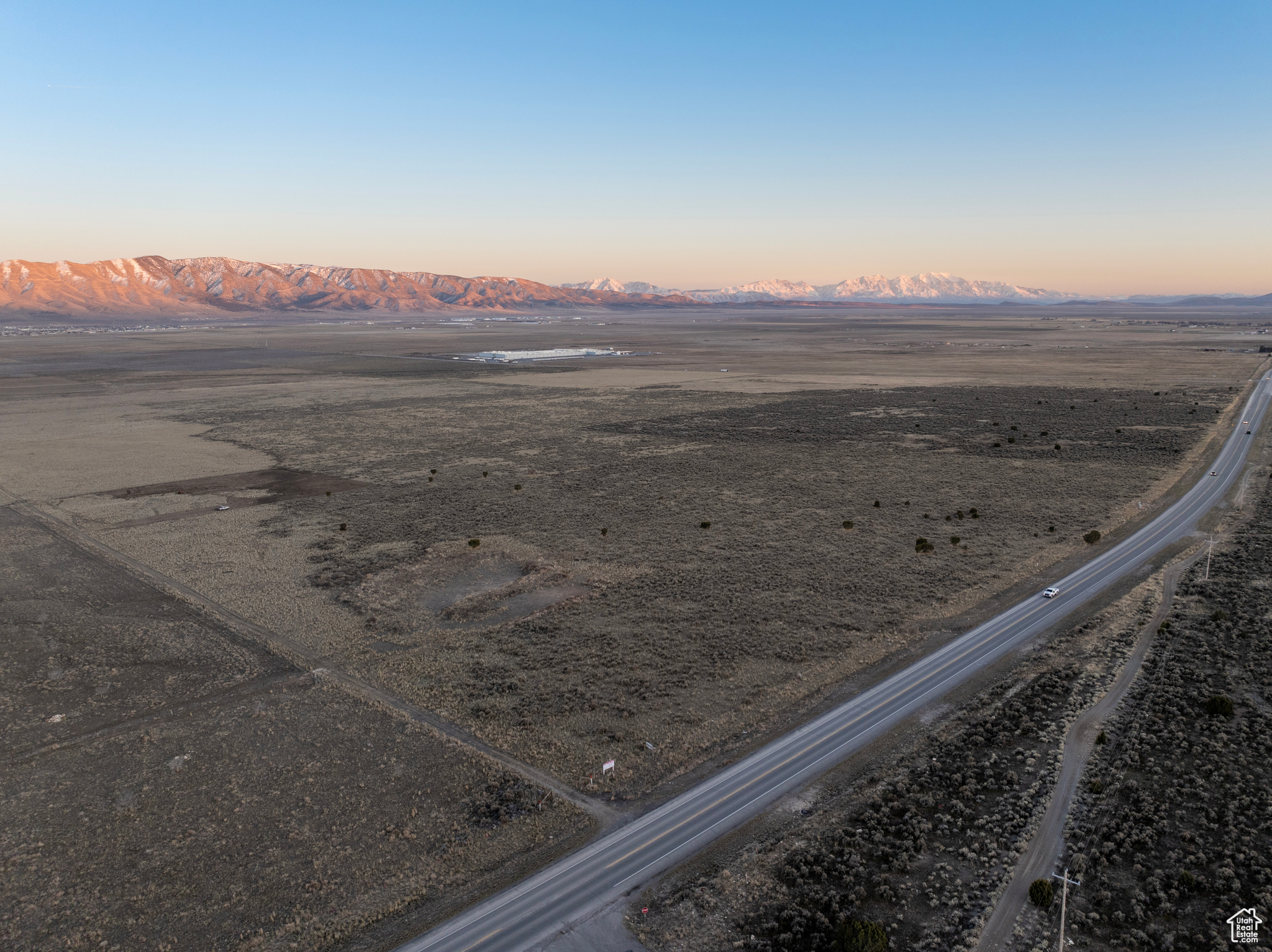 Aerial view at dusk with a mountain view and a rural view