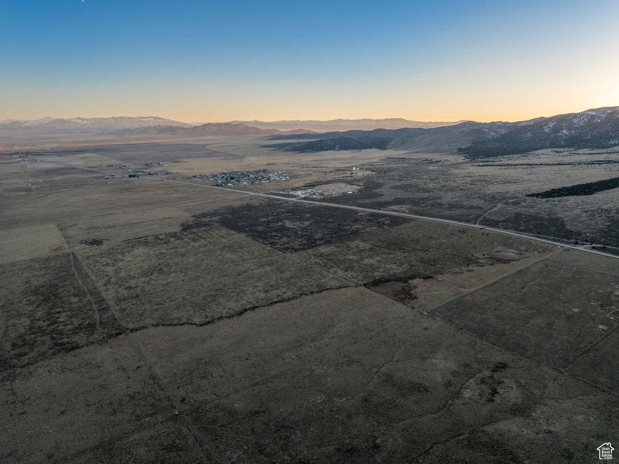 Aerial view at dusk with a mountain view