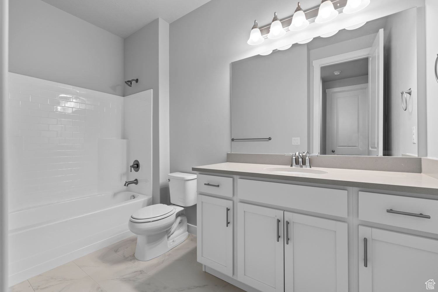Full bathroom with vanity, tile floors, shower / bathtub combination, and toilet
