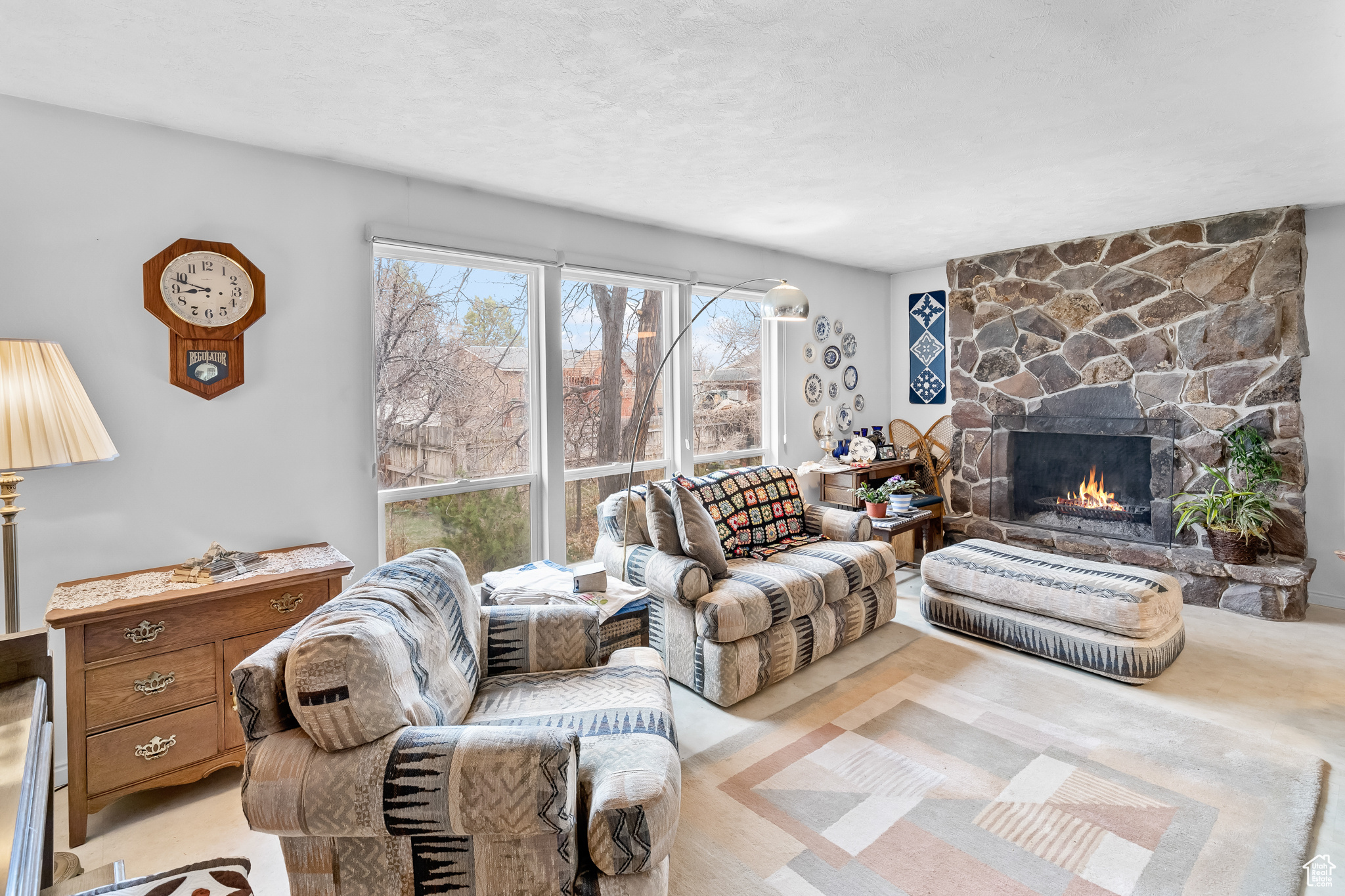 Living room featuring a fireplace and light colored carpet