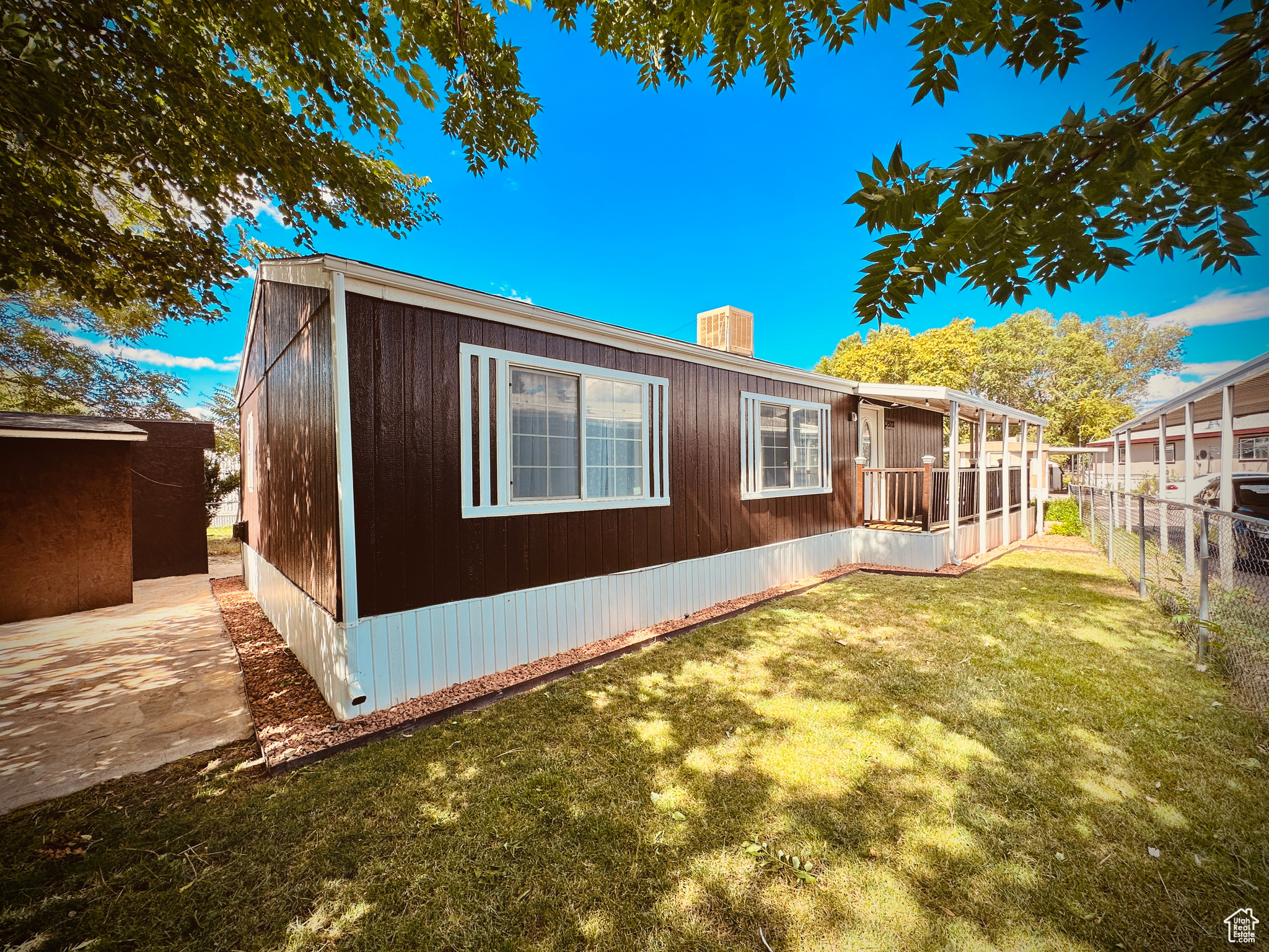 Rear view of house featuring a lawn