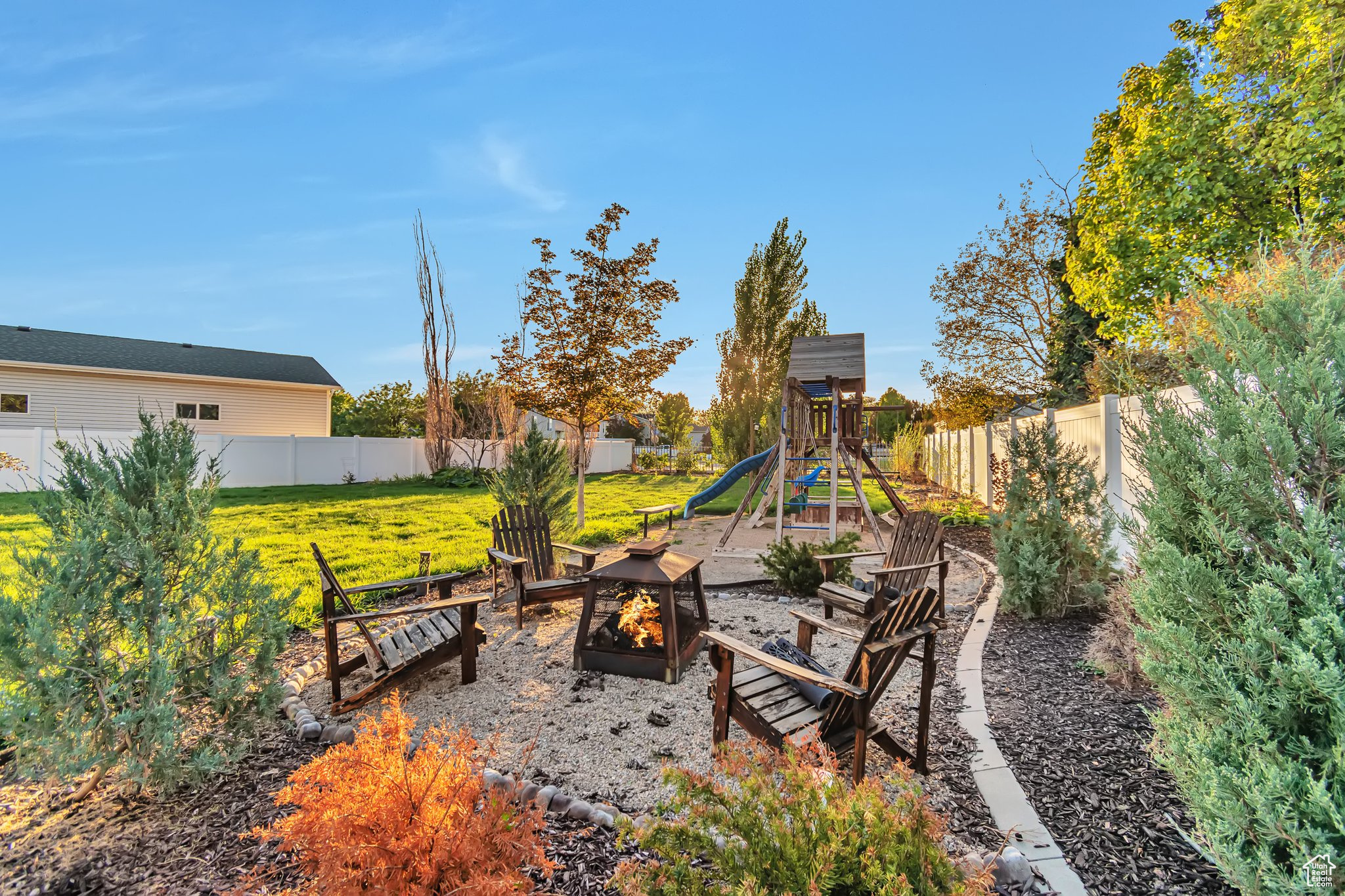 View of patio / terrace featuring a playground and fire pit area.