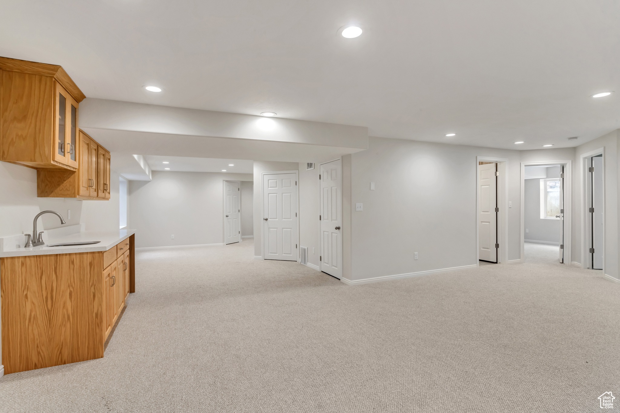Huge family room in basement with kitchenette with all new carpet. Perfect space for guests, entertaining, or privacy