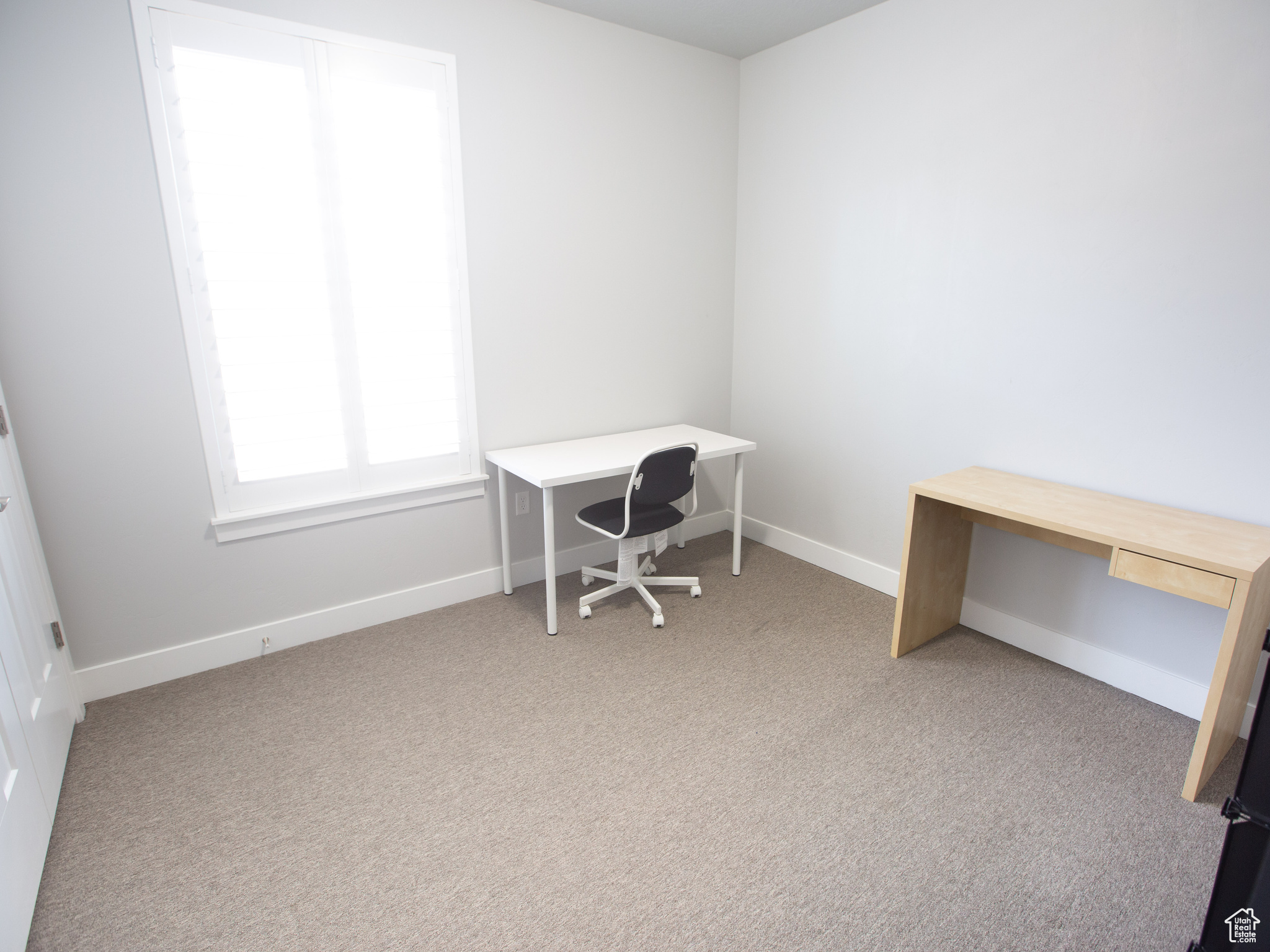 Unfurnished office with light carpet
